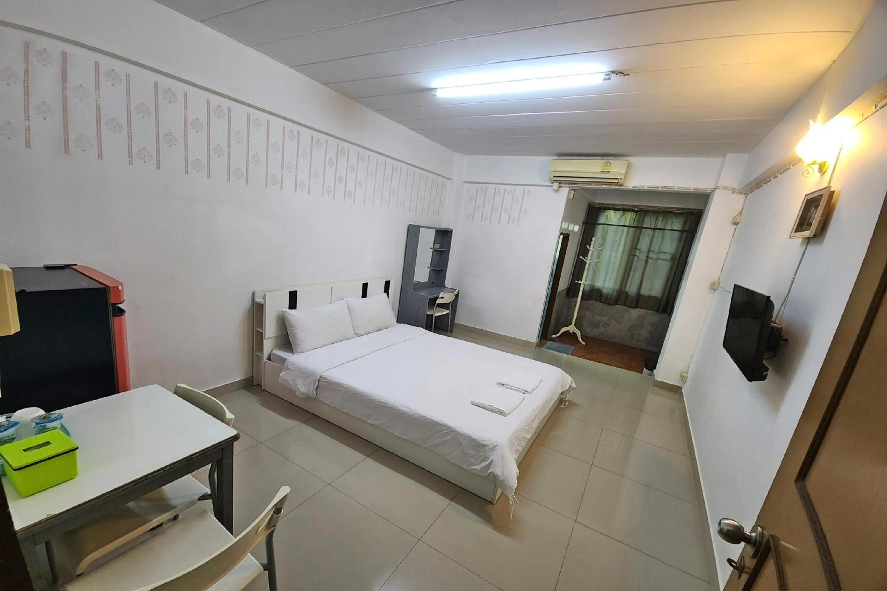 Bed in Green Apartment Kaset