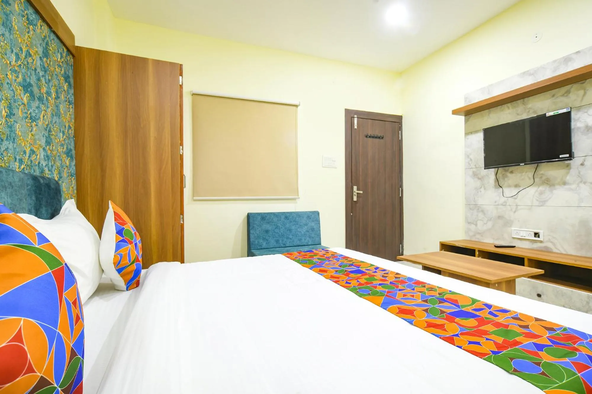 Bed in FabHotel Grand Giriraj