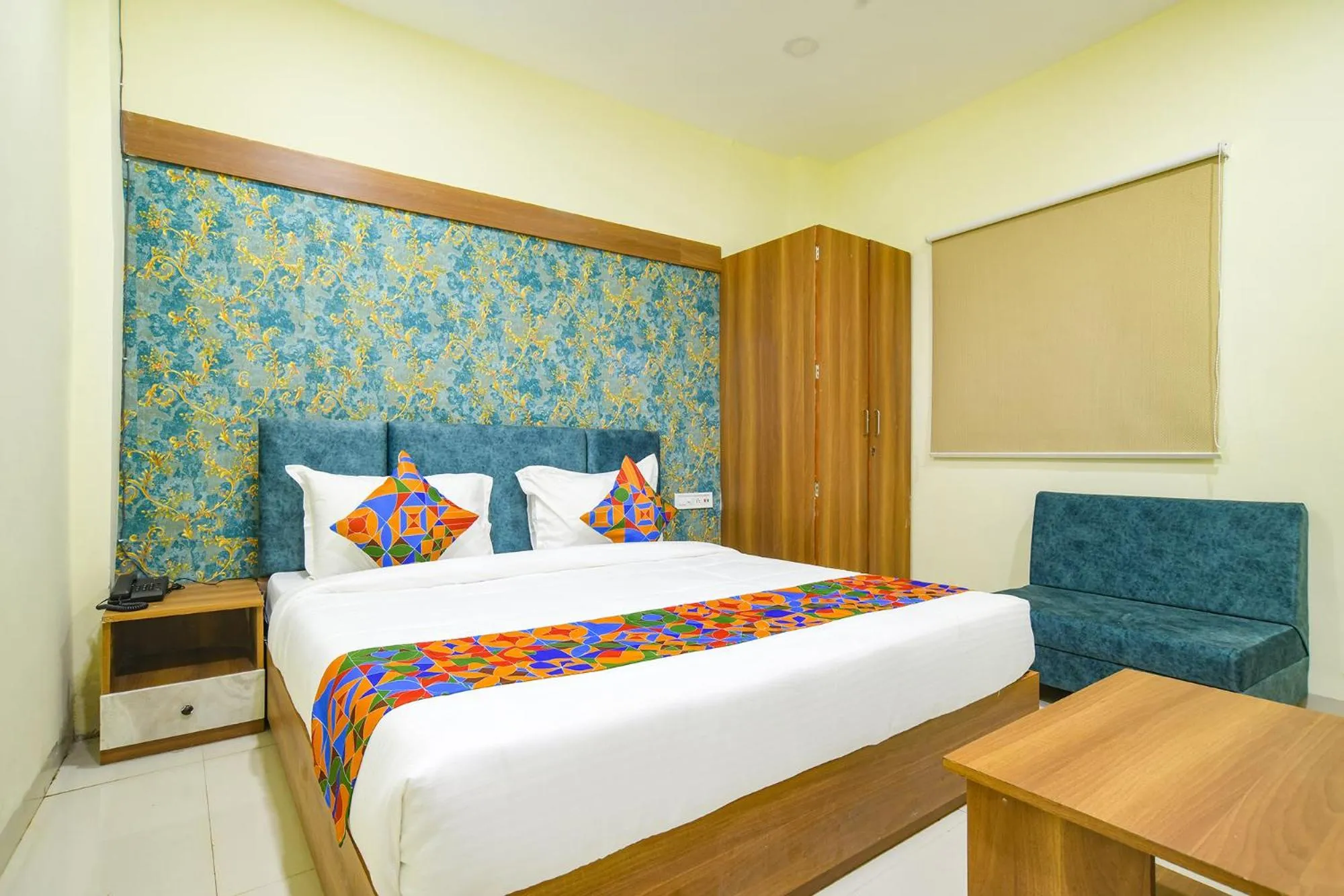 Bed in FabHotel Grand Giriraj