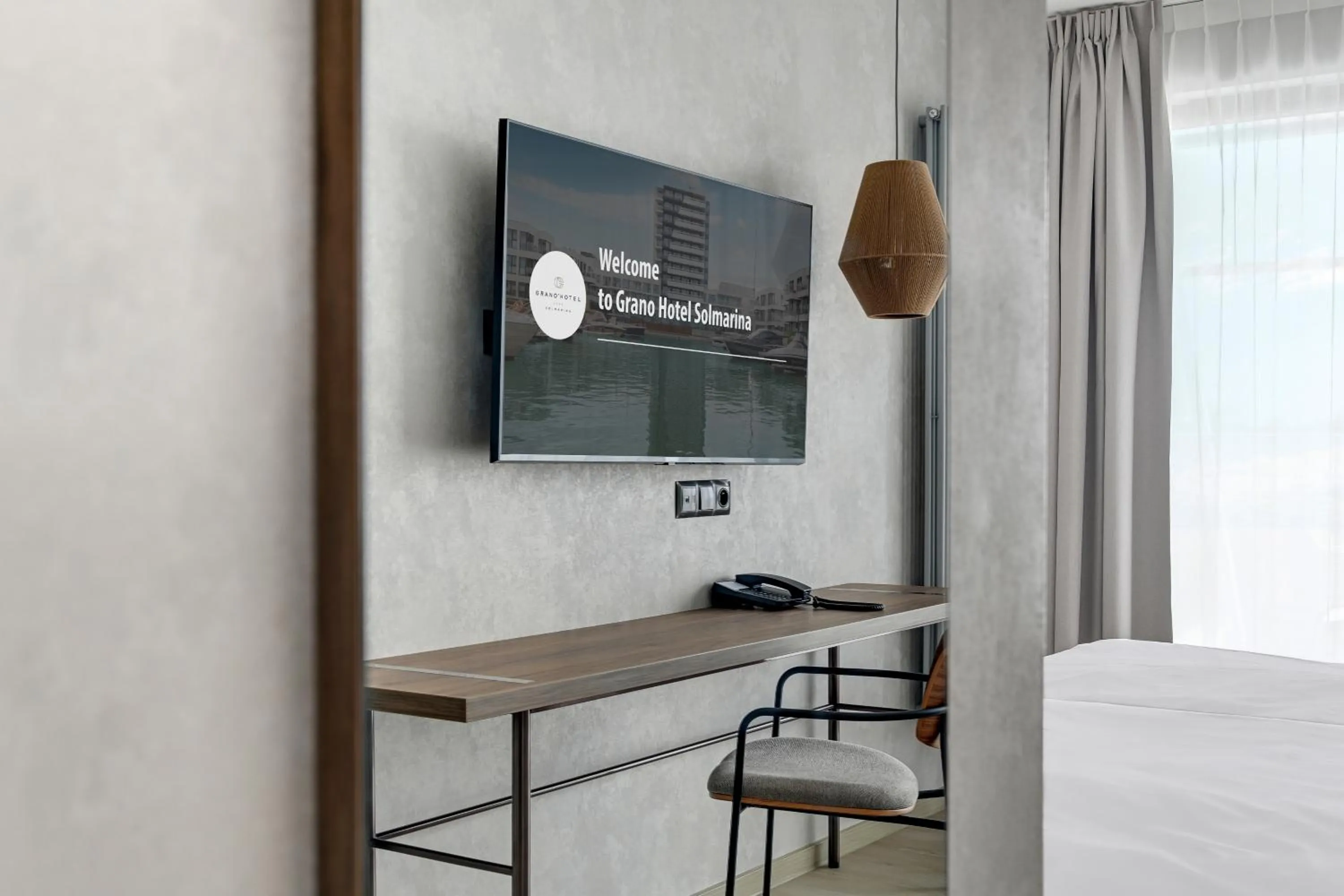 TV and multimedia, Bed in GRANO HOTEL Solmarina