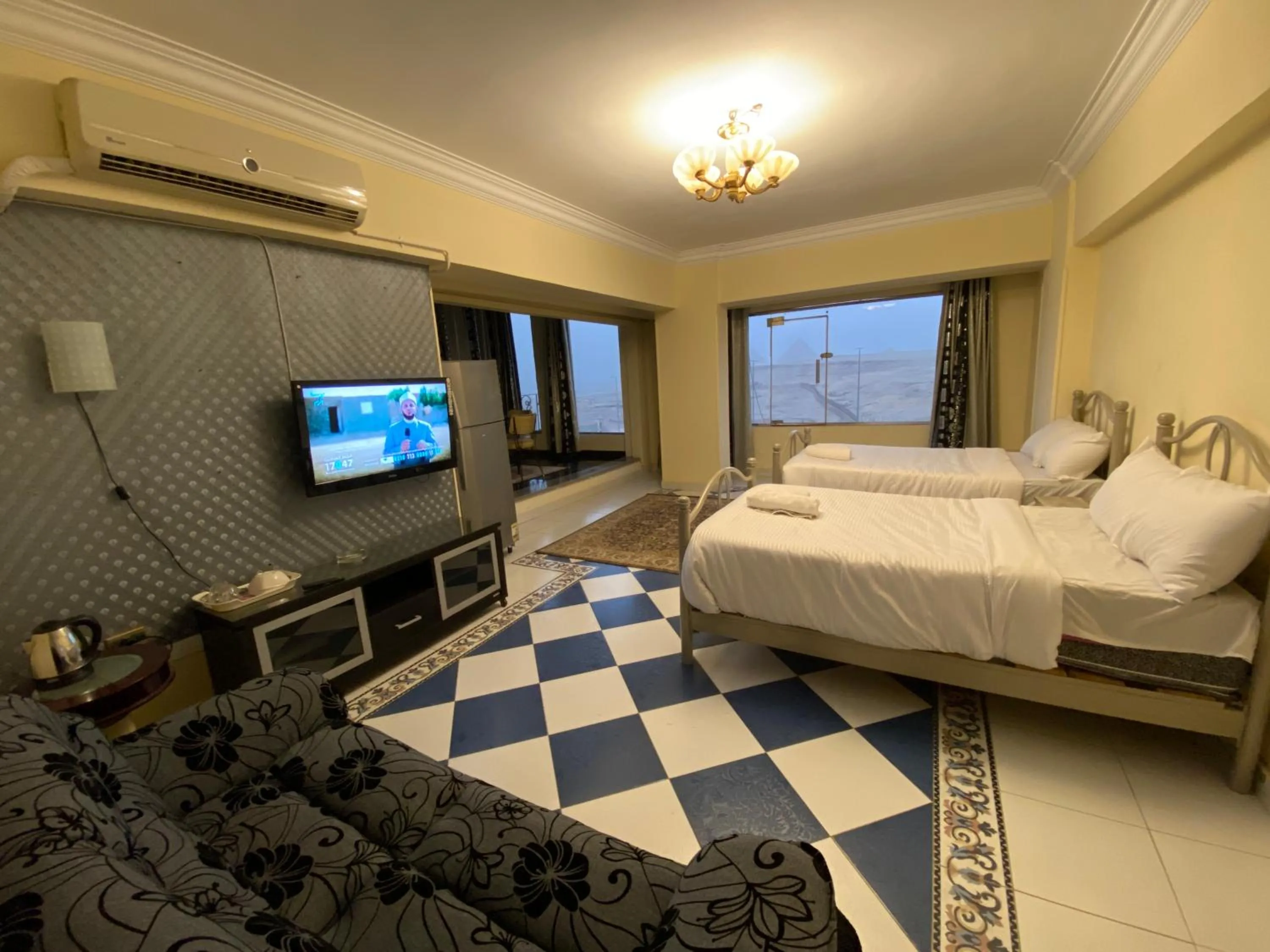 Communal lounge/ TV room, Bed in Pyramita Hotel