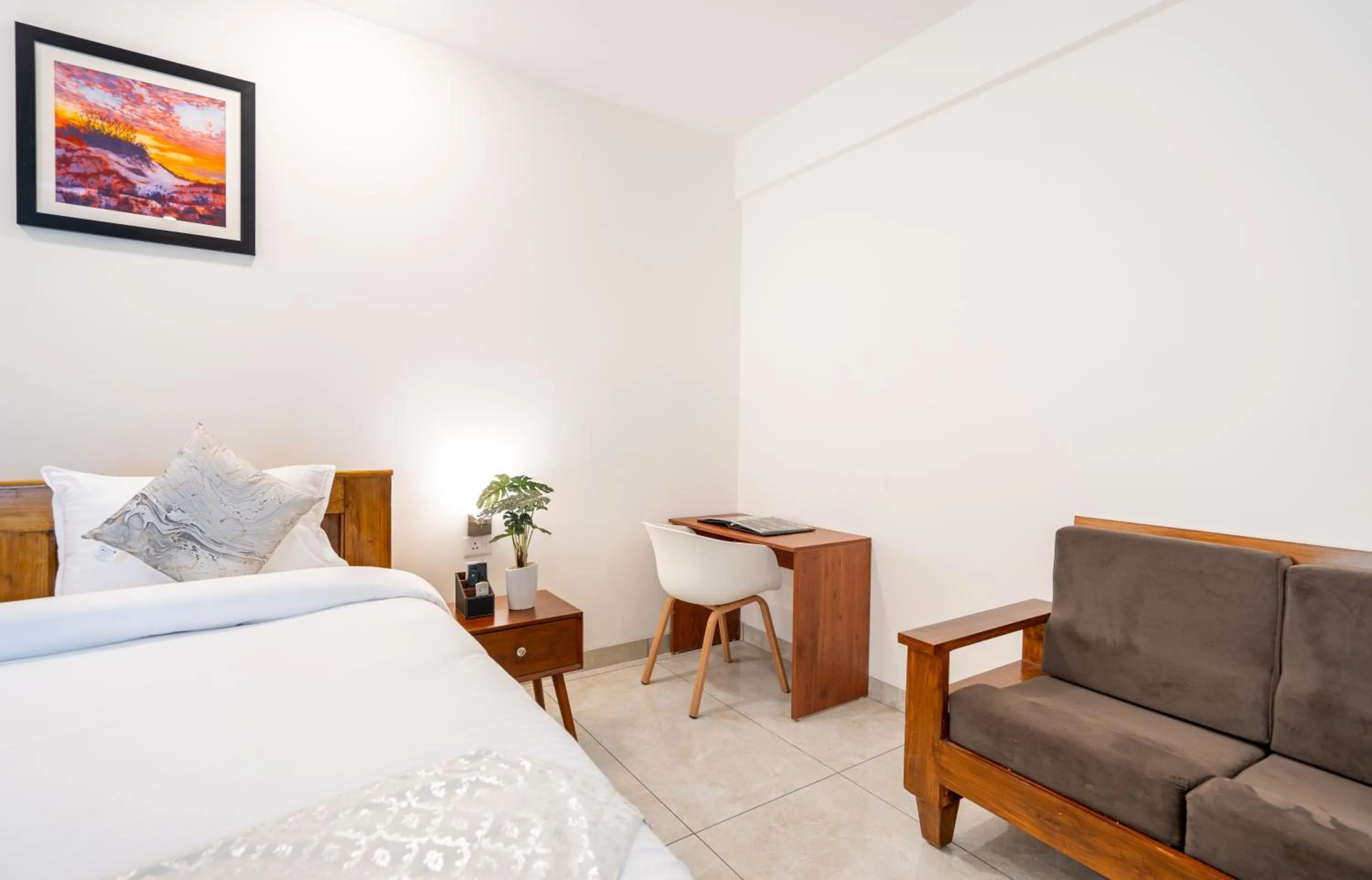 Bed in The Silver Chimes Suites