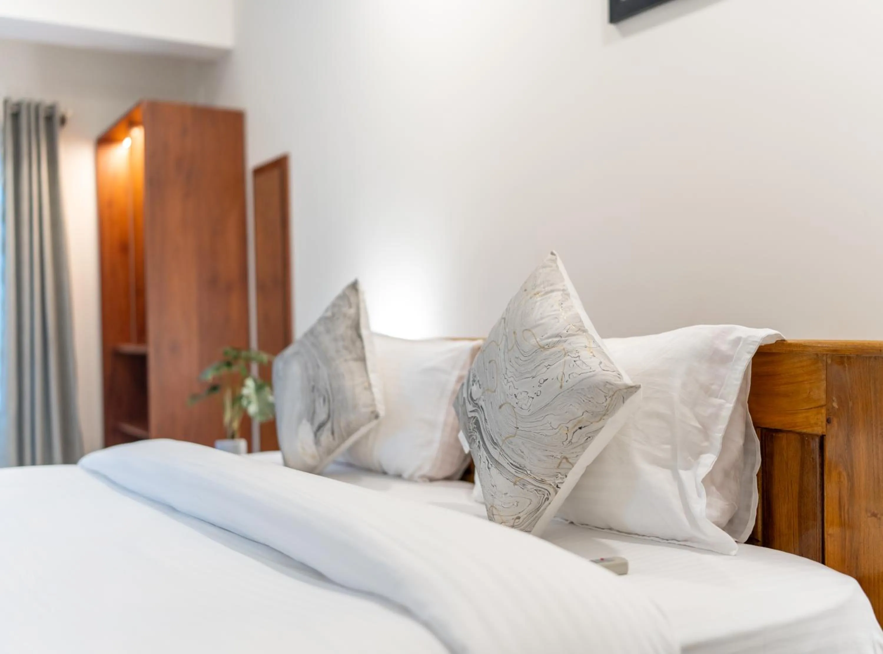 Bed in The Silver Chimes Suites