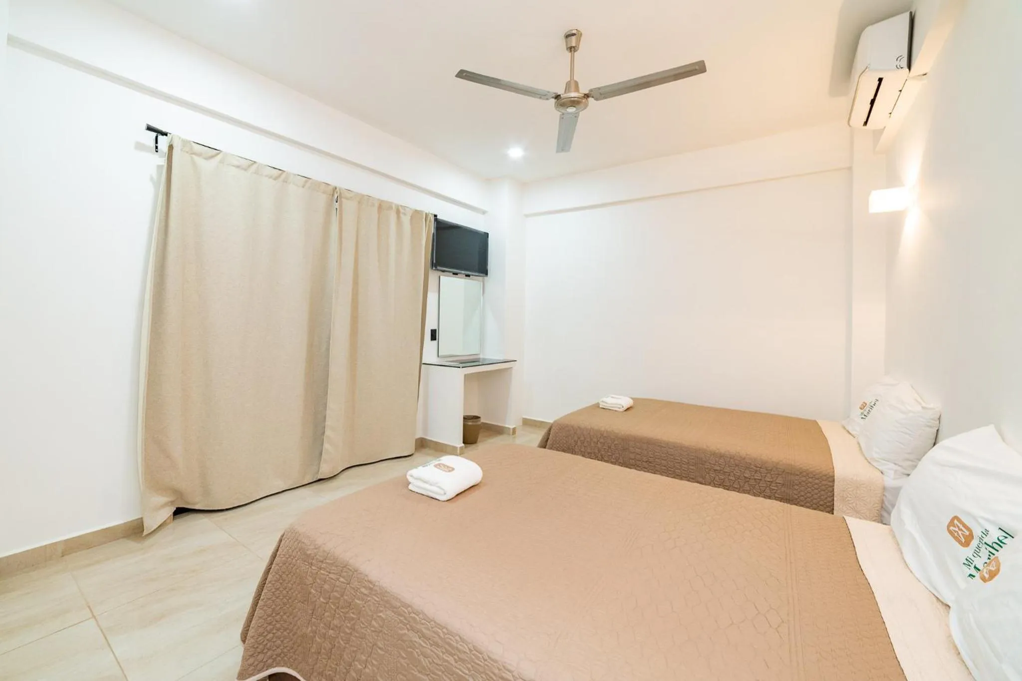 Bed in Mi Querida Maribel Hotel