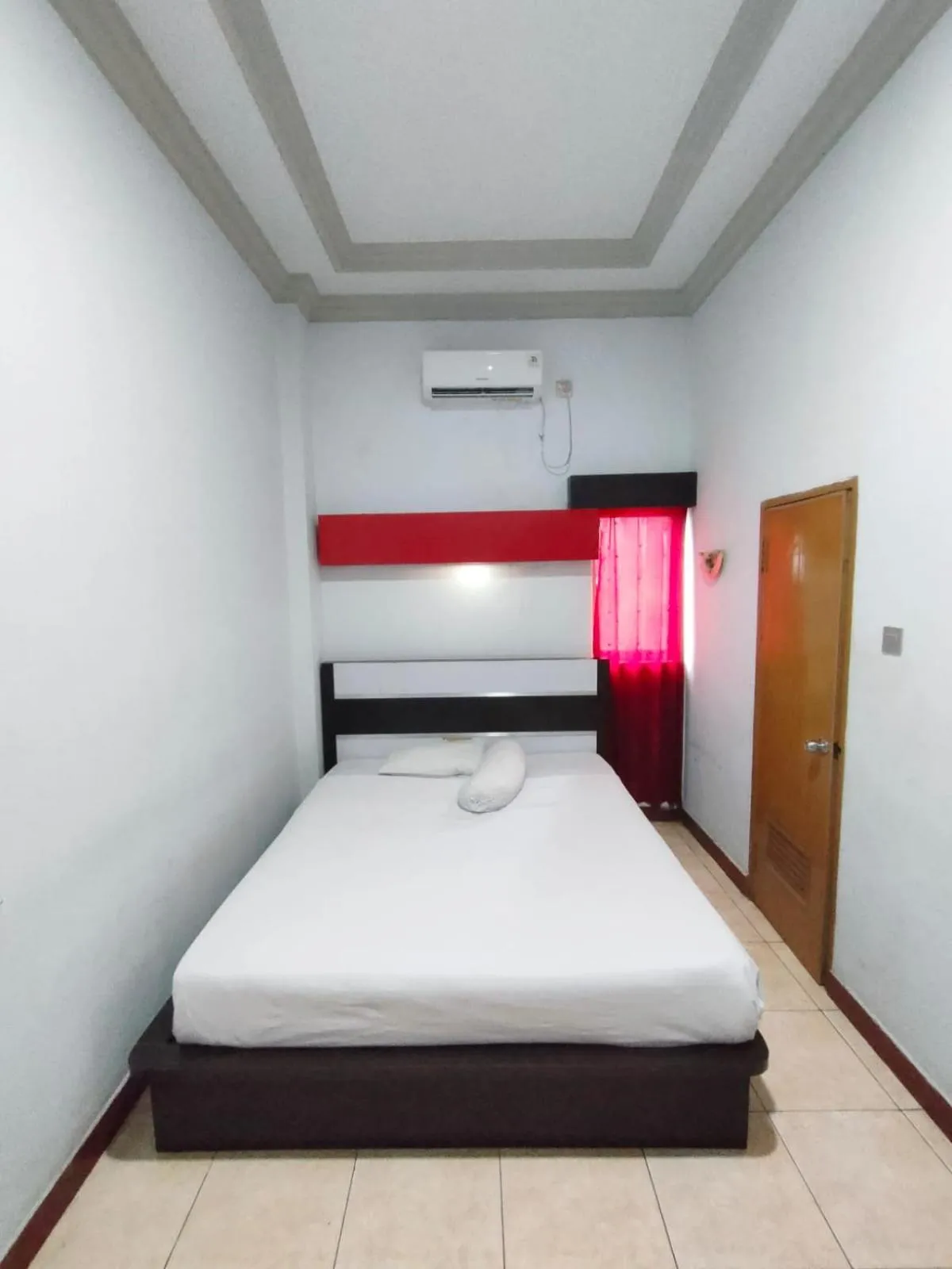 Bed in Hotel Riverside Manado