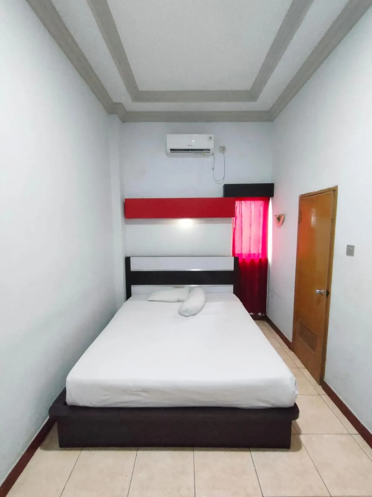 Bed in Hotel Riverside Manado