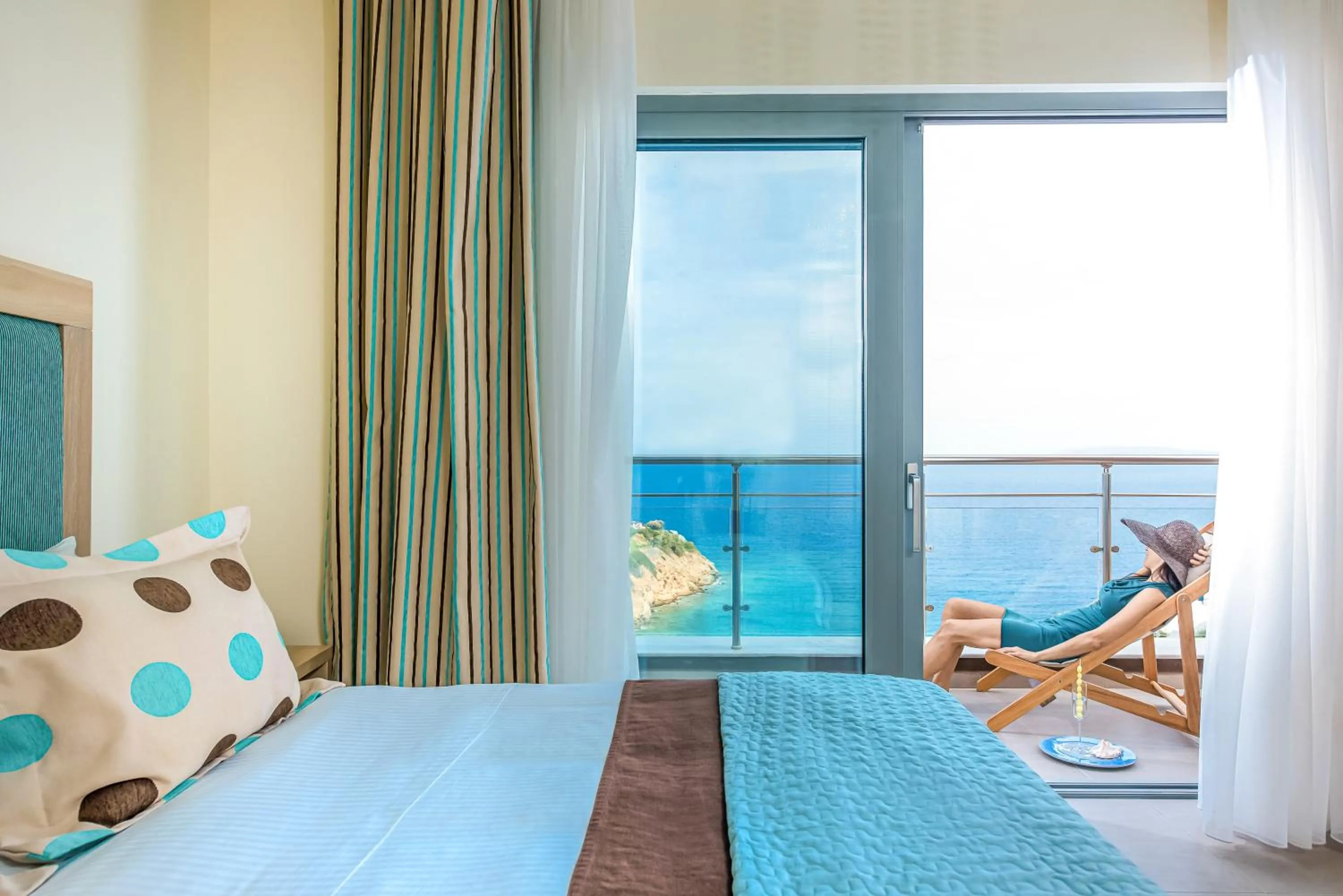 Balcony/Terrace, Bed in Blue Bay Resort Hotel