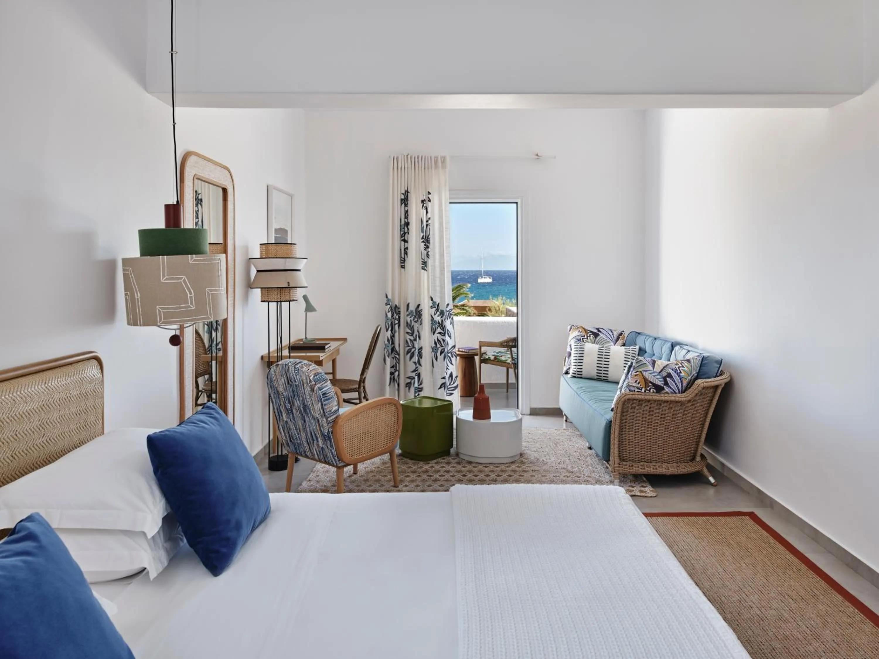 Bed in Myconian Sunrise Relais & Chateaux Hotel