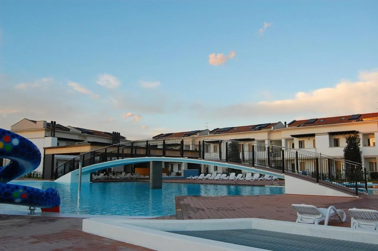 Bright fenced garden flat with swimming pool