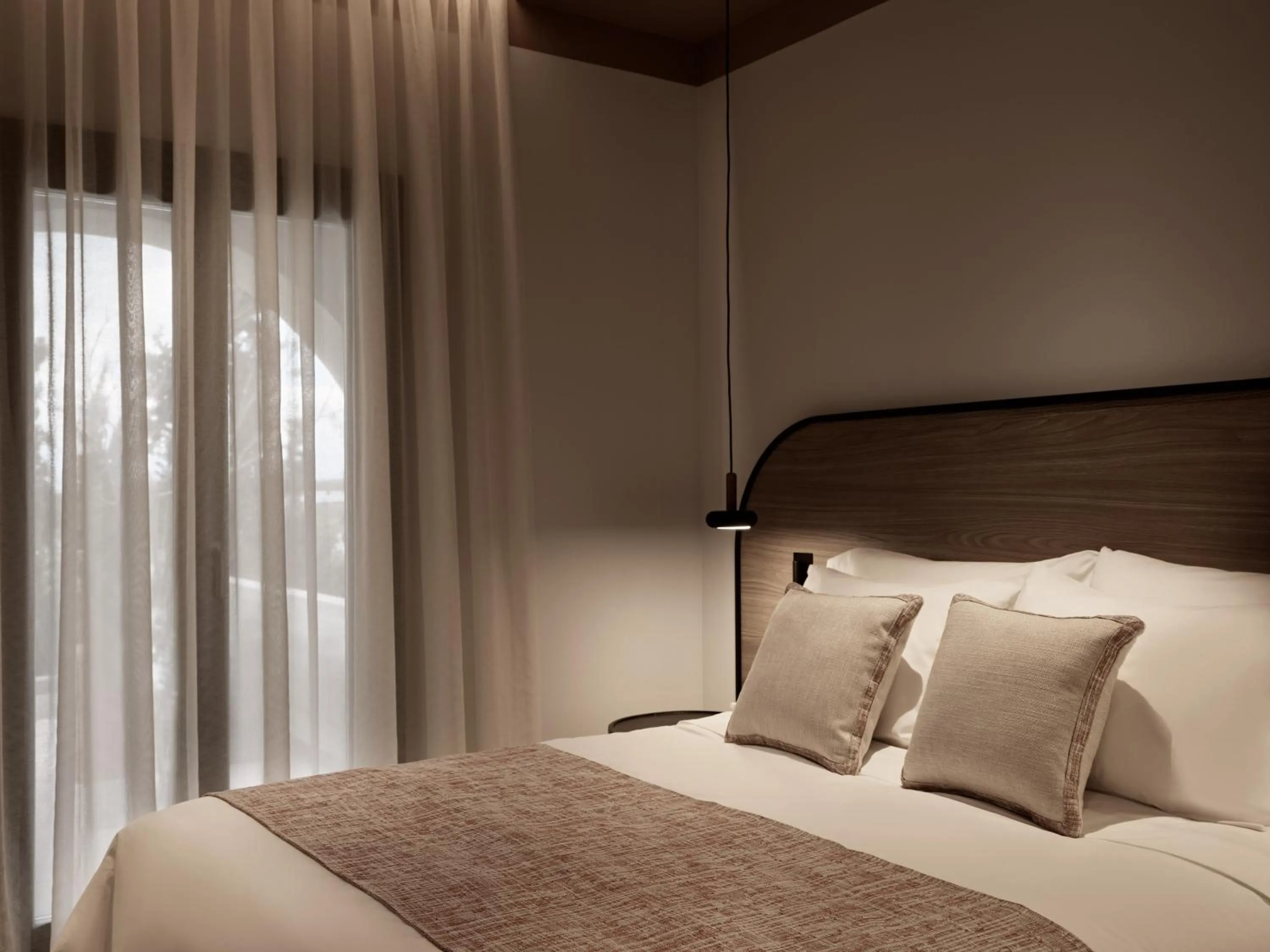 Bed in NAUMA PAROS Design Boutique Hotel-Adults Only