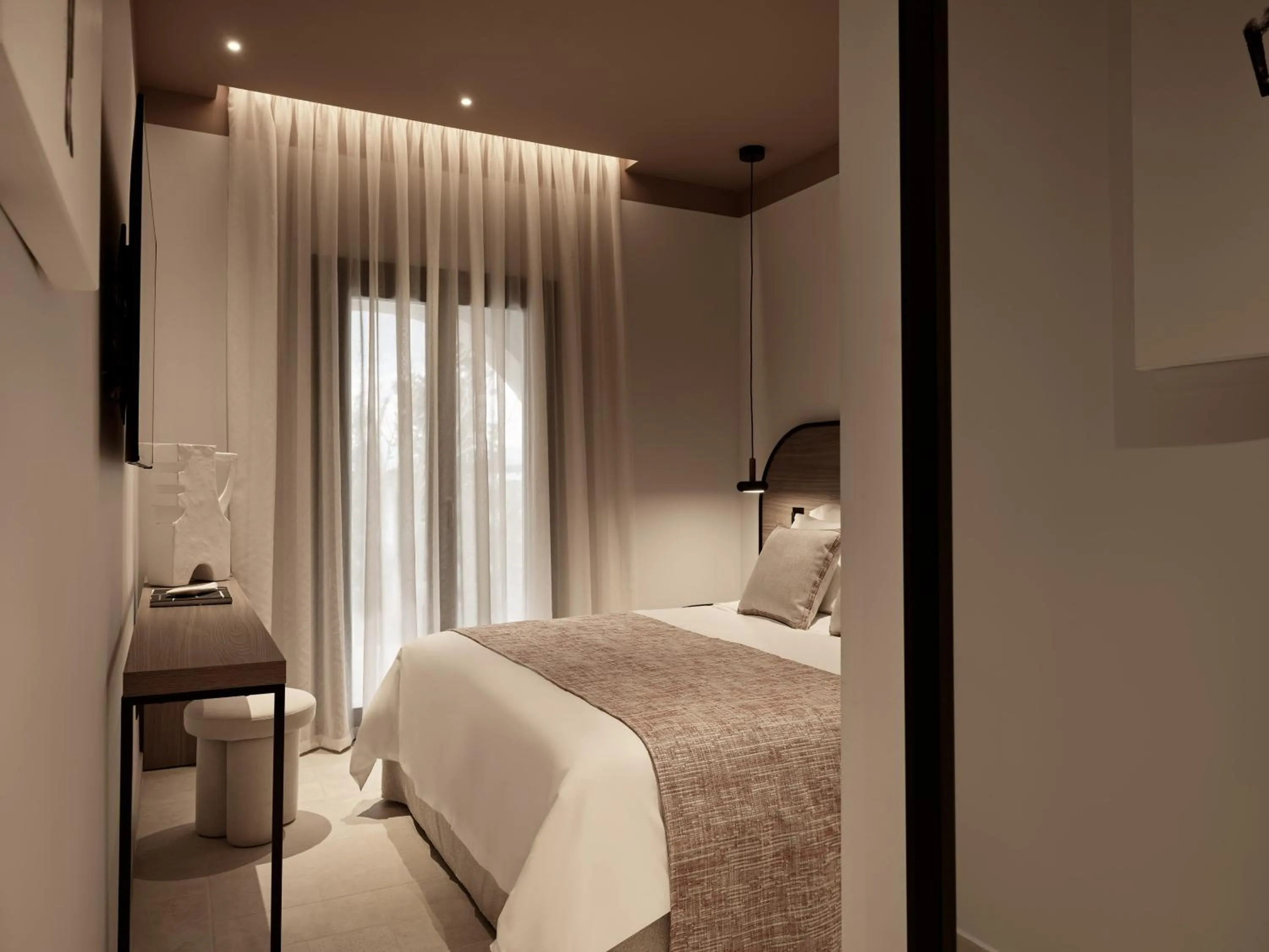 Bed in NAUMA PAROS Design Boutique Hotel-Adults Only