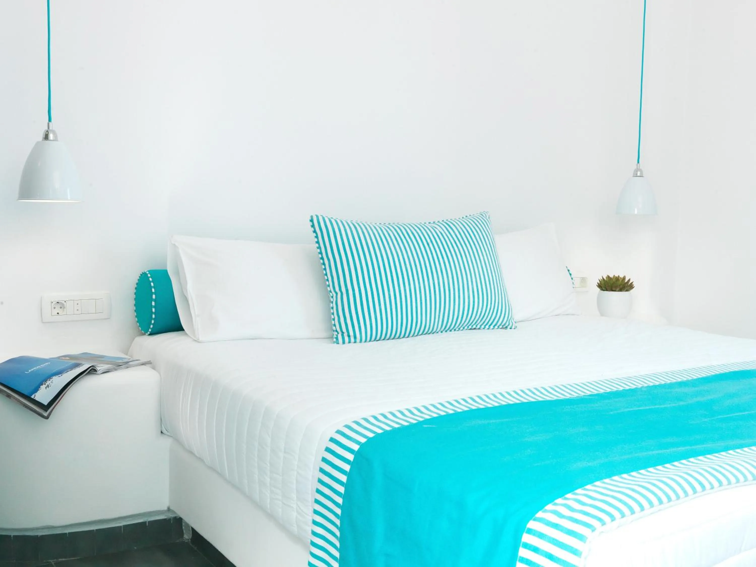 Bed in Evgenia Villas & Suites by Calm Collection