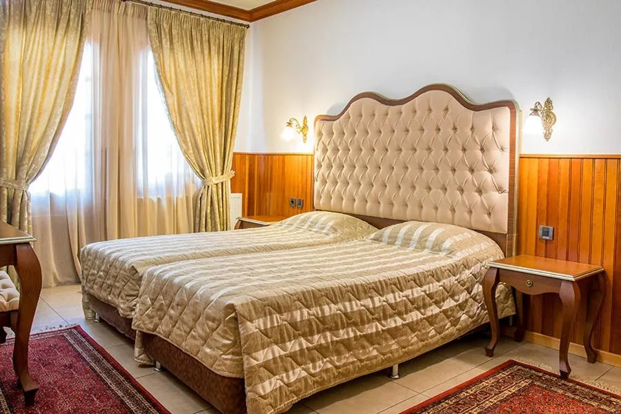 Bed in Hotel Apollon