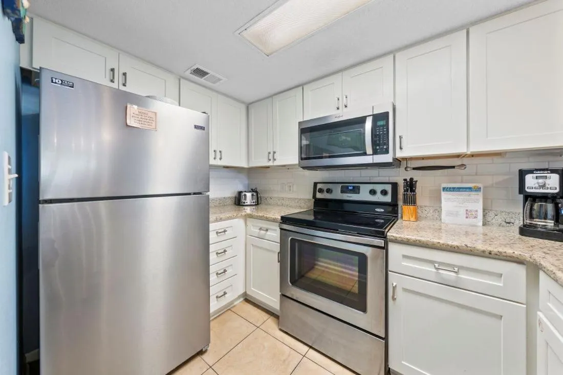 Kitchen or kitchenette in Romar Tower 7C by Youngs Suncoast