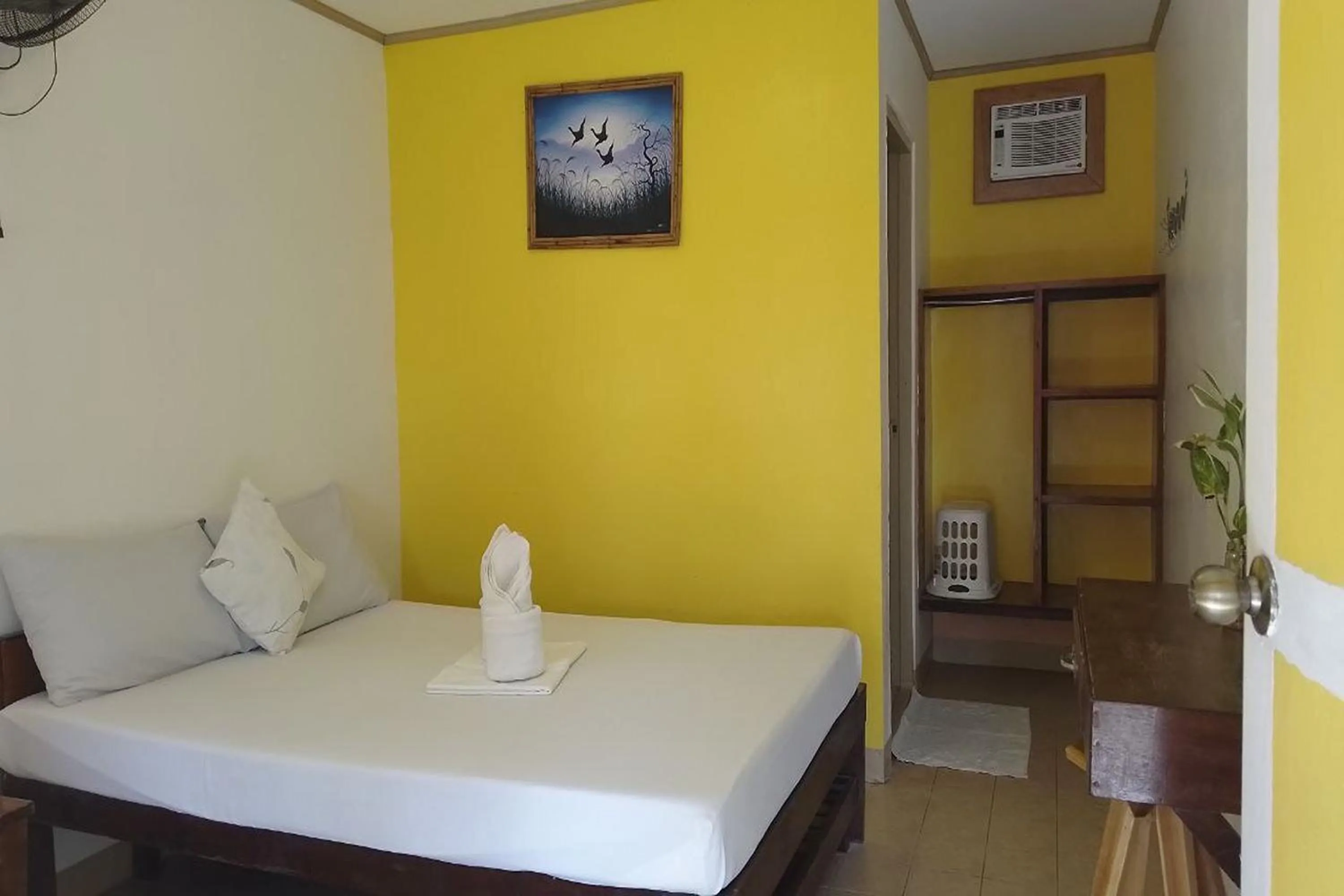 Bed in Summer Homes Beach Front Resort and Cottages Port Barton