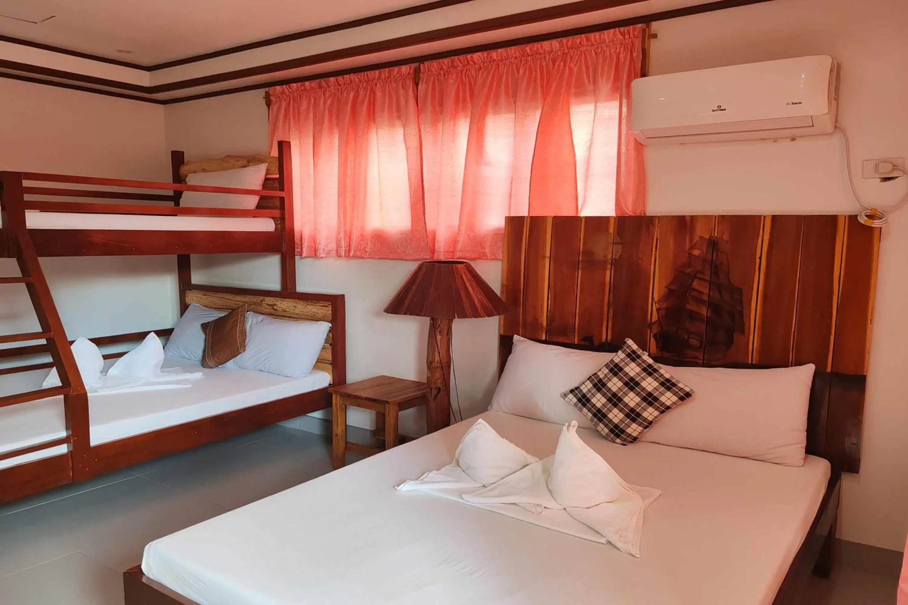 Bed in Summer Homes Beach Front Resort and Cottages Port Barton