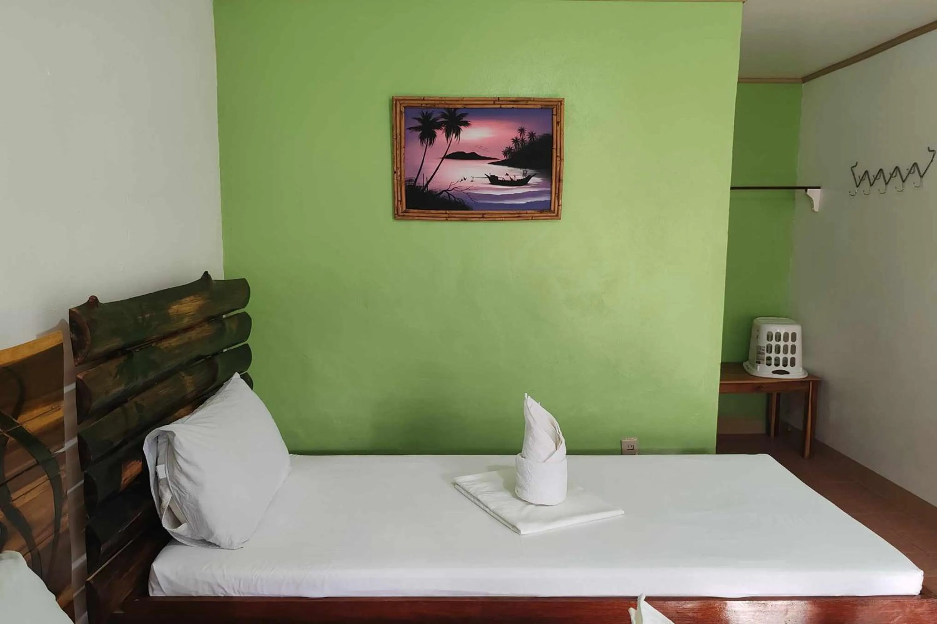 Bed in Summer Homes Beach Front Resort and Cottages Port Barton