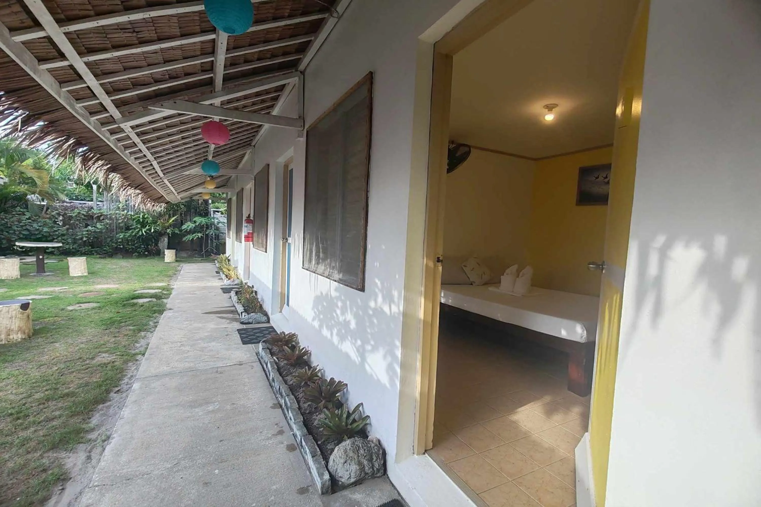 Patio, Bed in Summer Homes Beach Front Resort and Cottages Port Barton