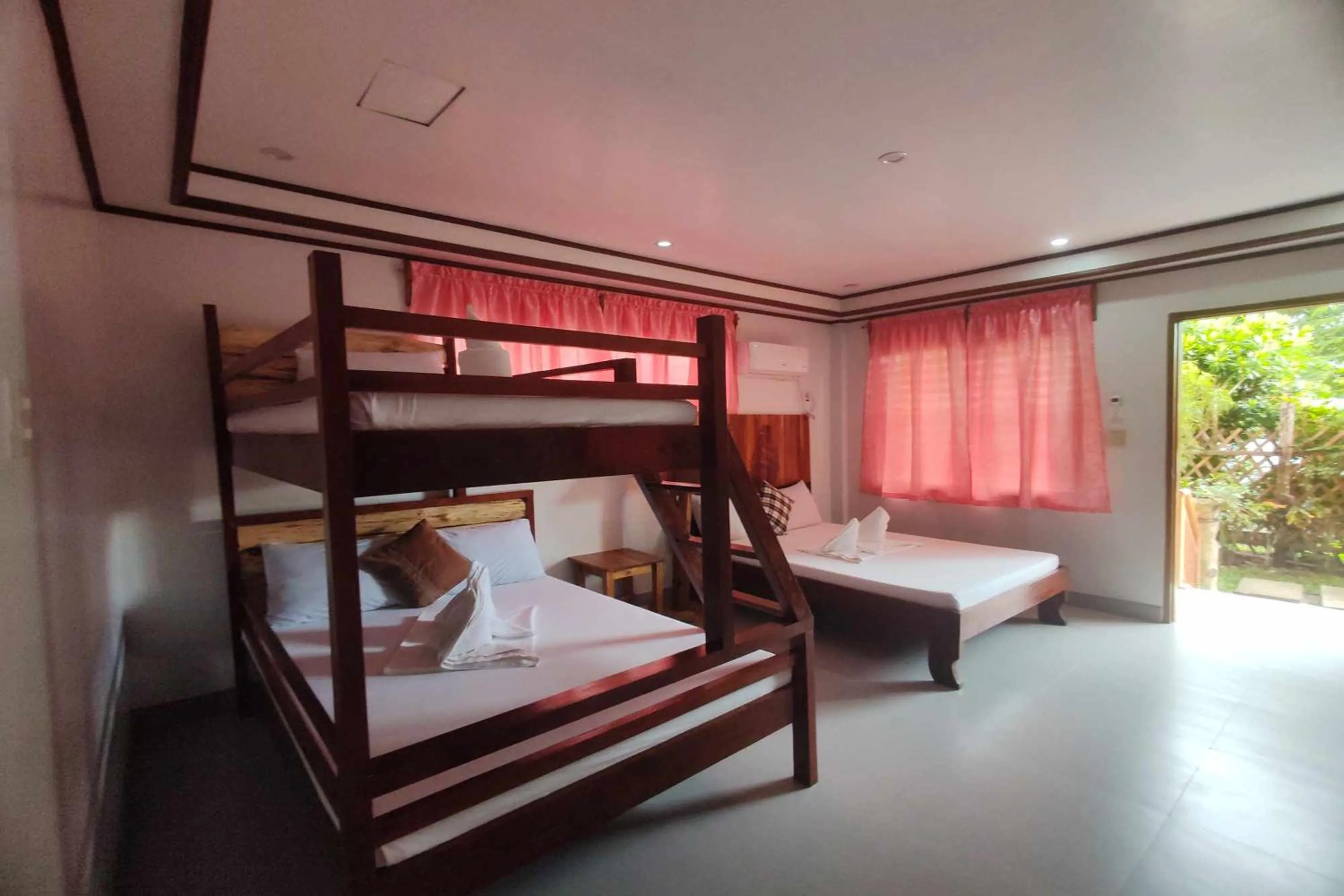 Bed in Summer Homes Beach Front Resort and Cottages Port Barton