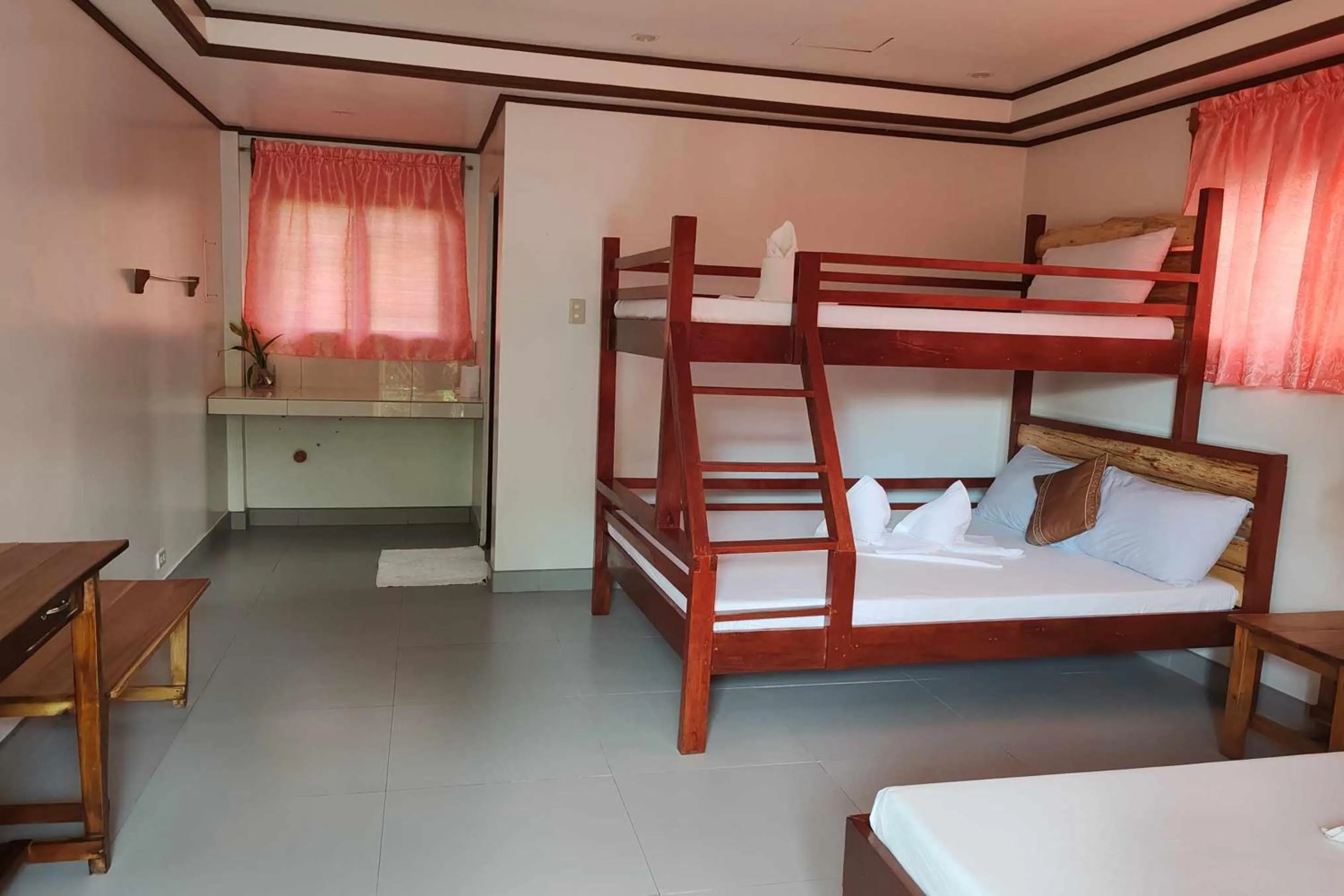 Bed in Summer Homes Beach Front Resort and Cottages Port Barton