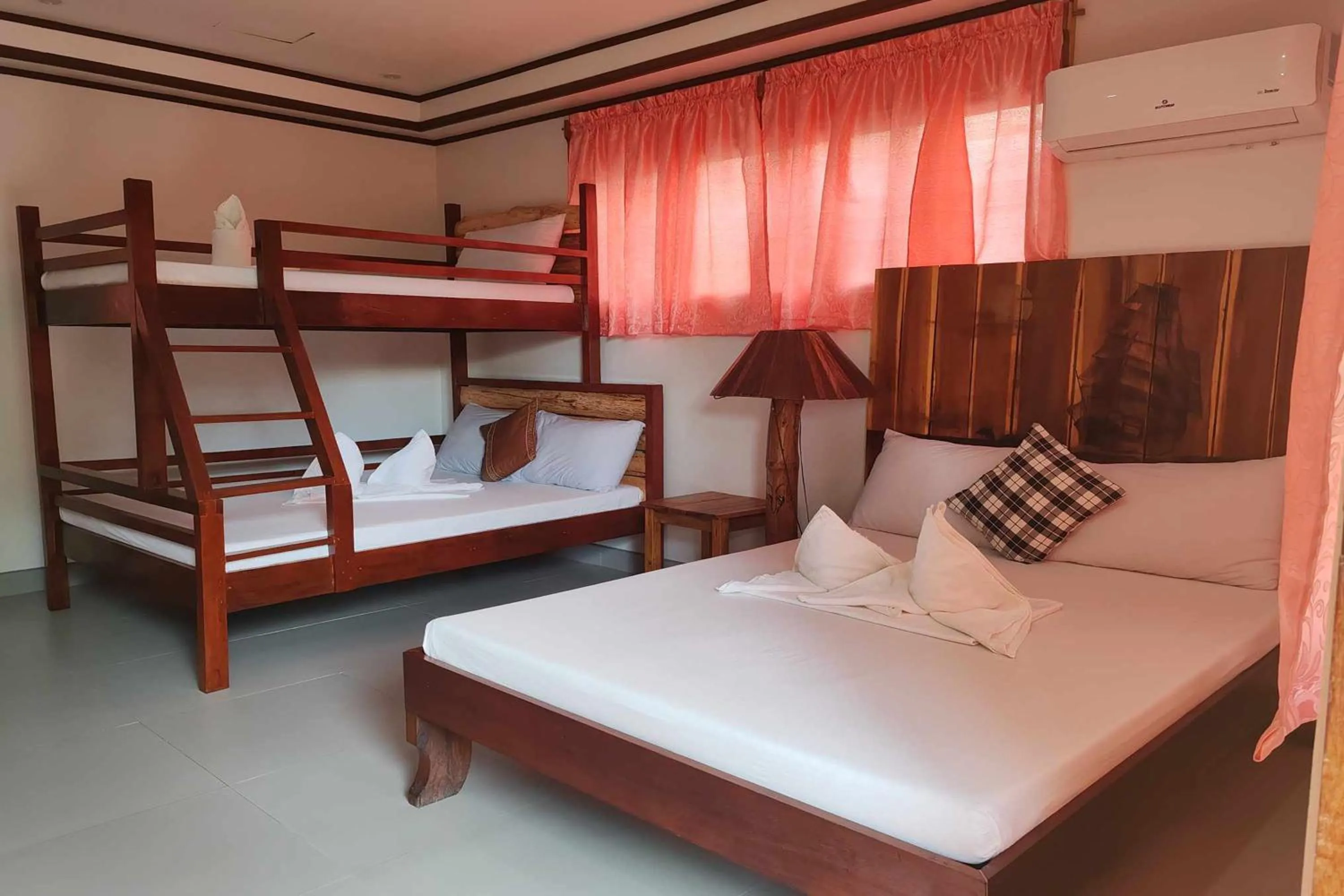 Bed in Summer Homes Beach Front Resort and Cottages Port Barton