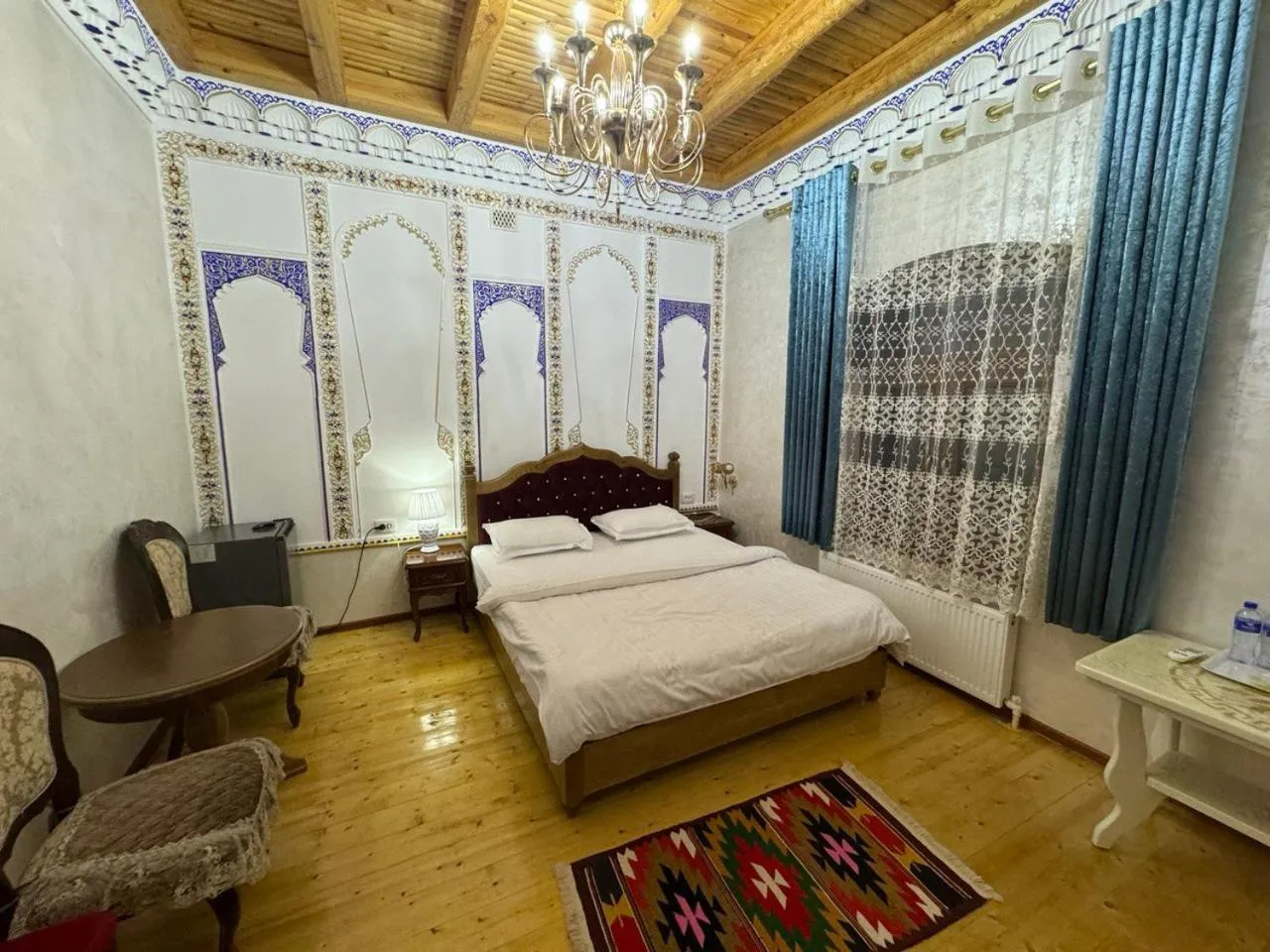 Living room, Bed in Central Asia Hotel