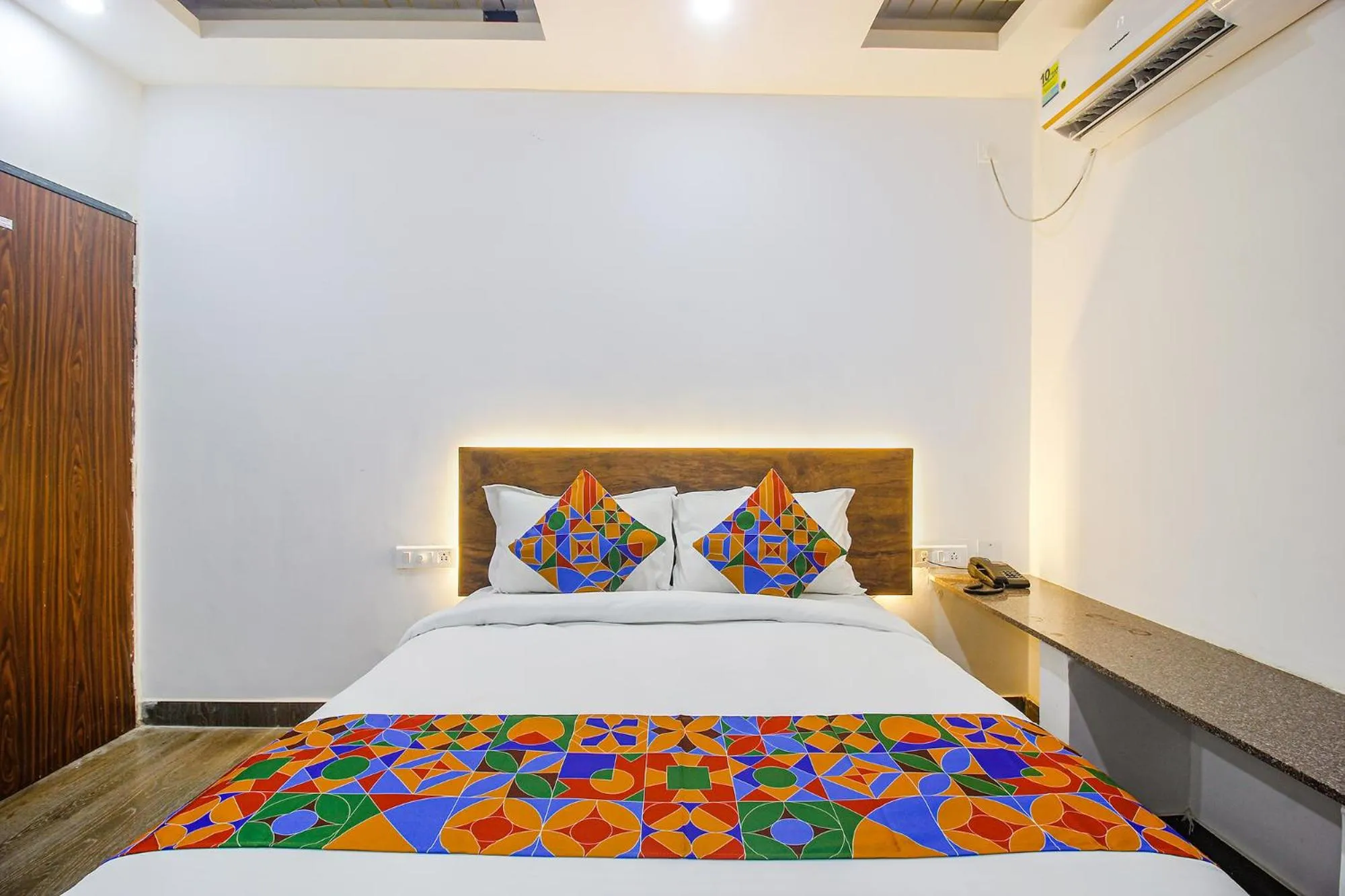 Bed in FabHotel W Grand Suites