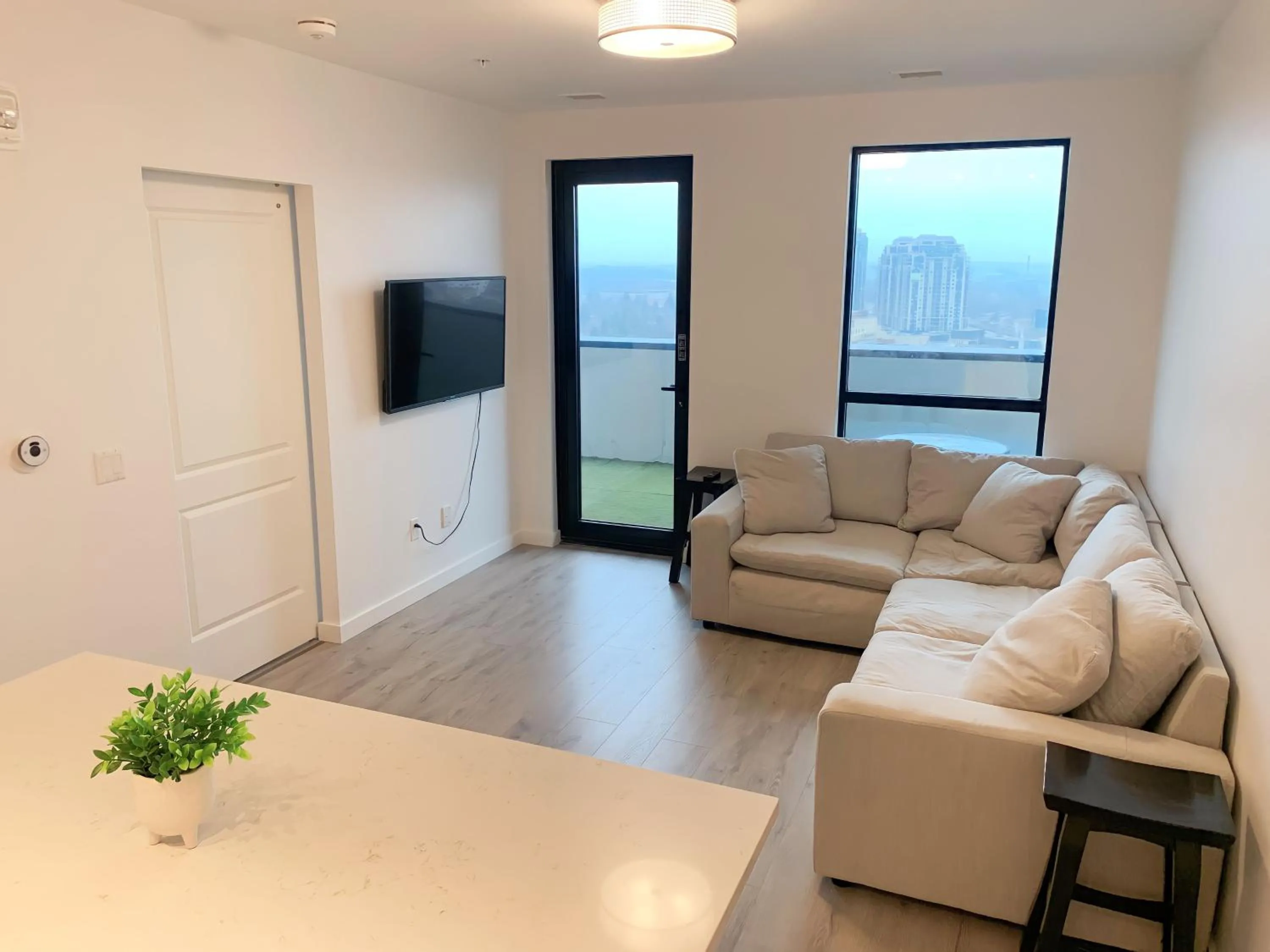 Living room in Cozy 1BR Condo w/ Insuite LDRY, Gym & Free Parking