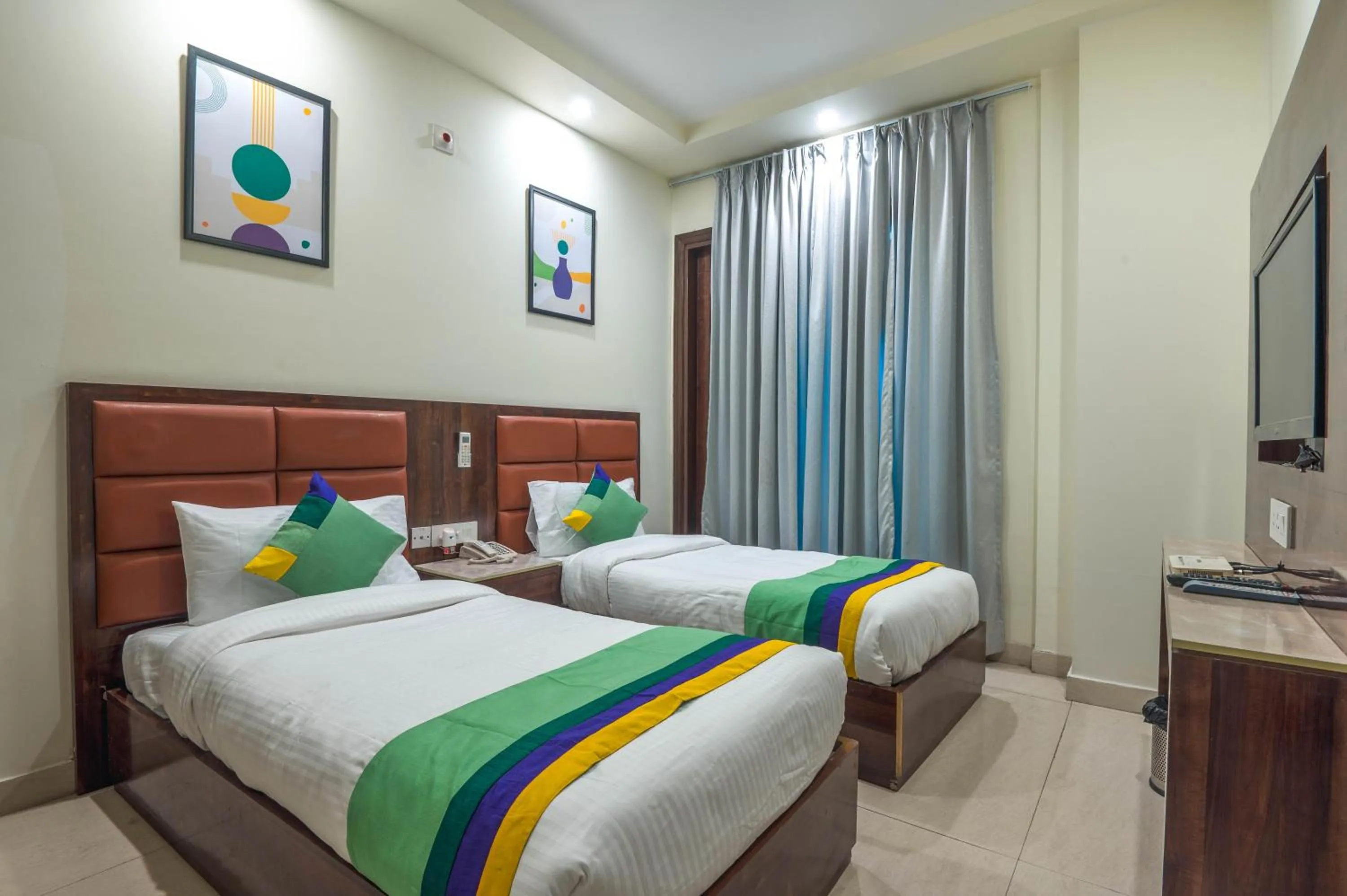 Bedroom, Bed in Treebo Sunny Feast