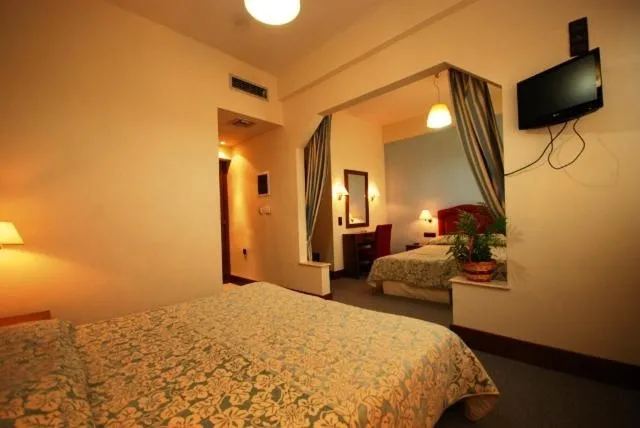 Bed in Hotel Elvetia