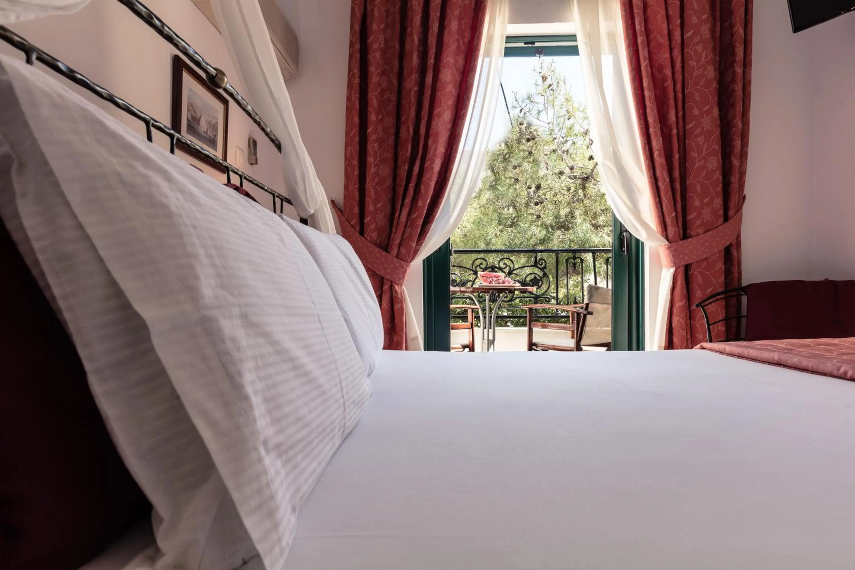 Bed in Dionysos Hotel