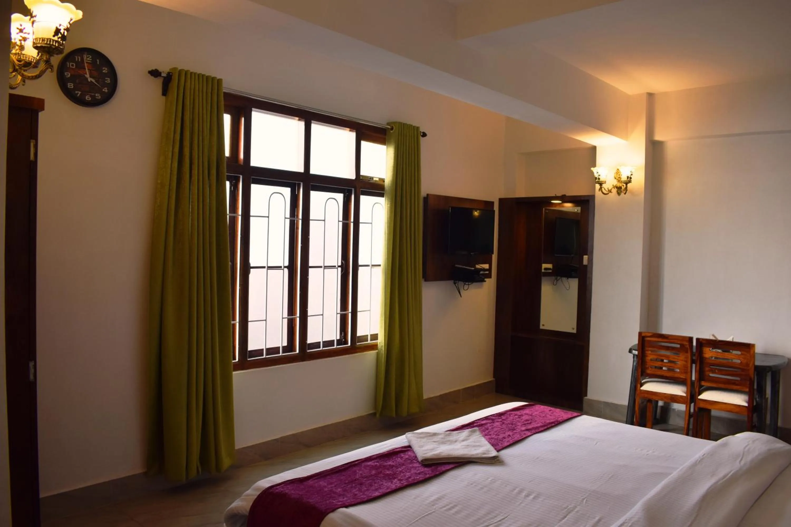 Bed in LILY GUEST HOUSE