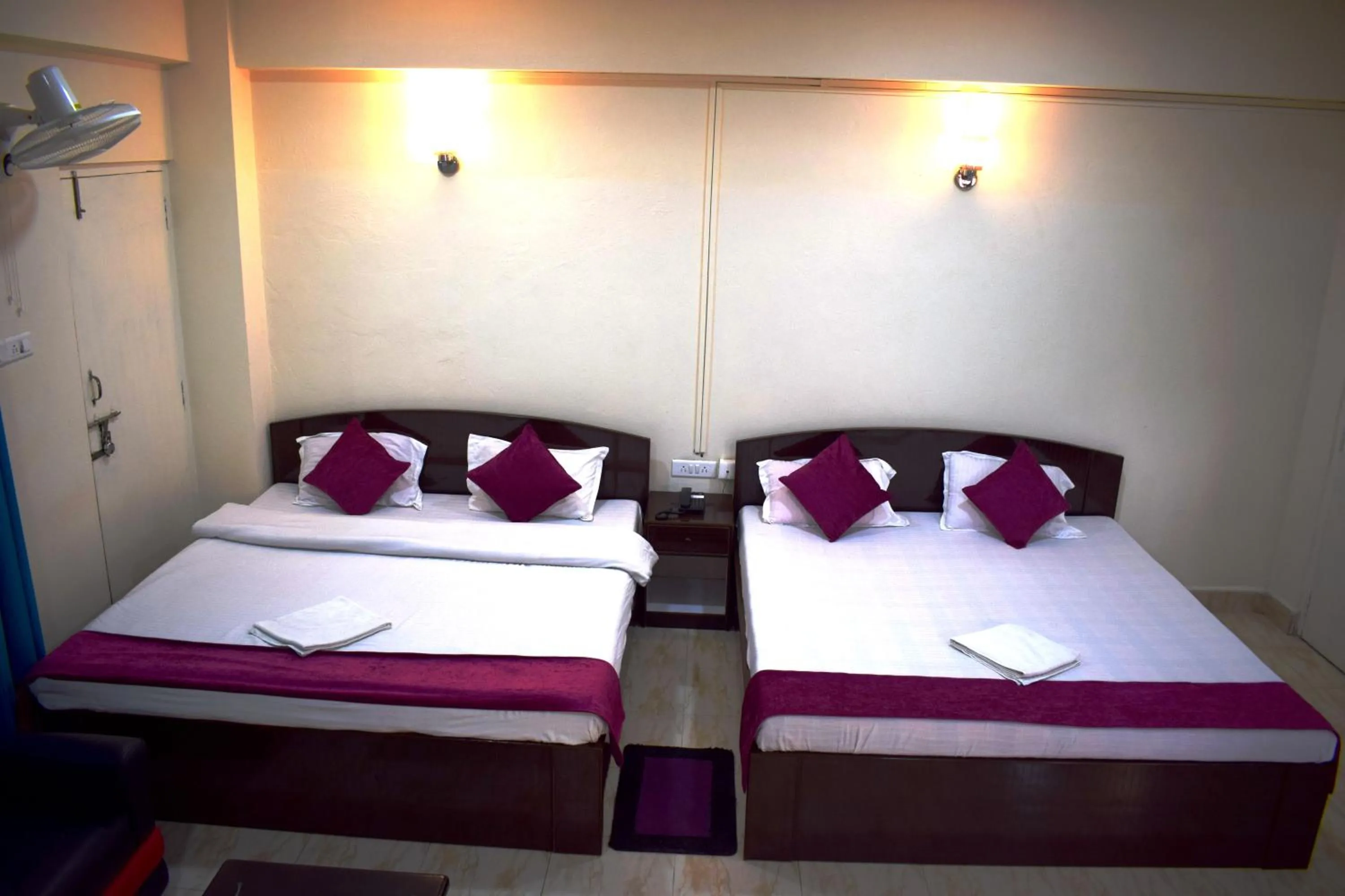 Bed in LILY GUEST HOUSE