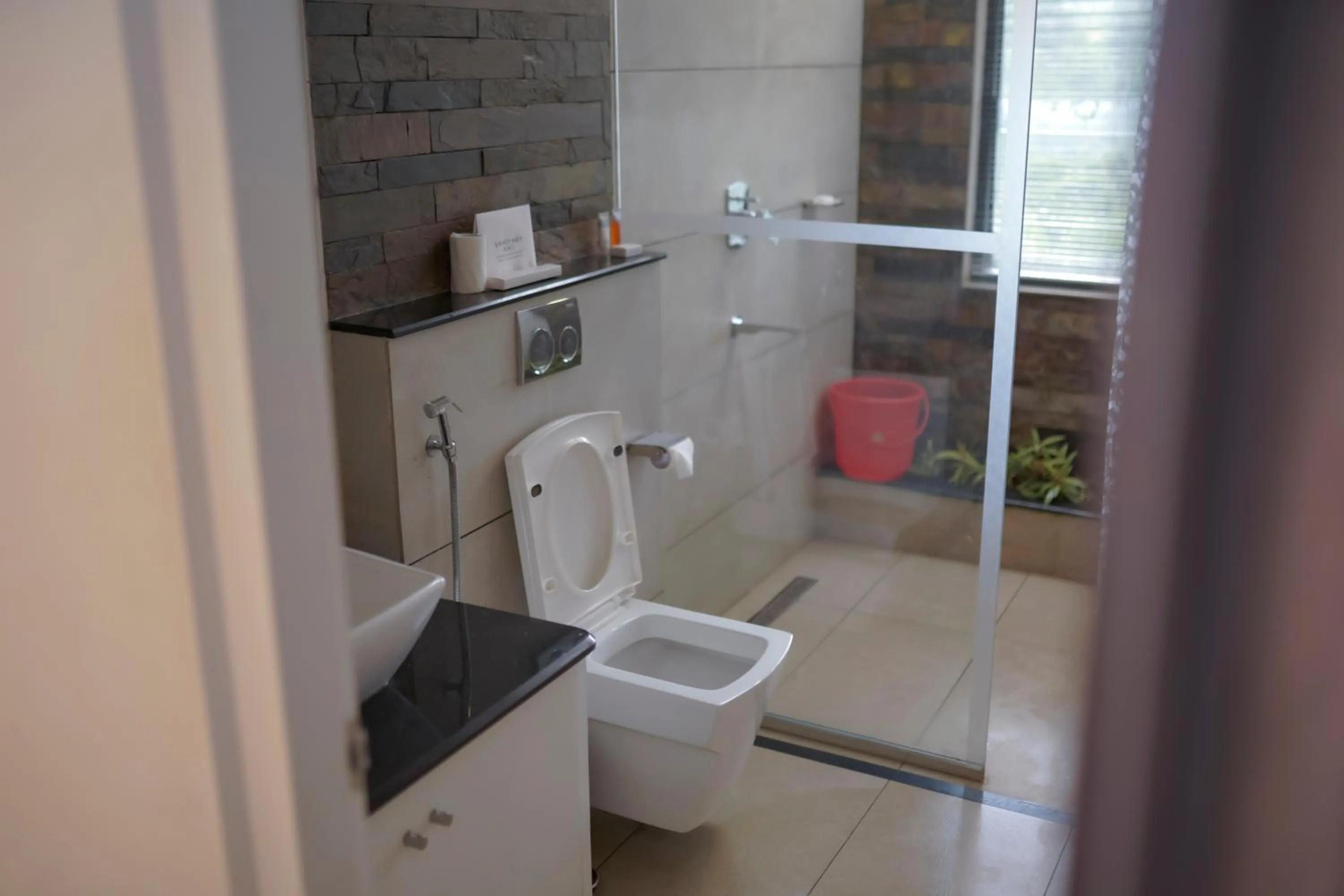 Toilet in PEKOE Plantation Cottages by LexStays