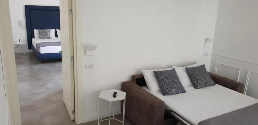 Bed in RAVIDA SUITES