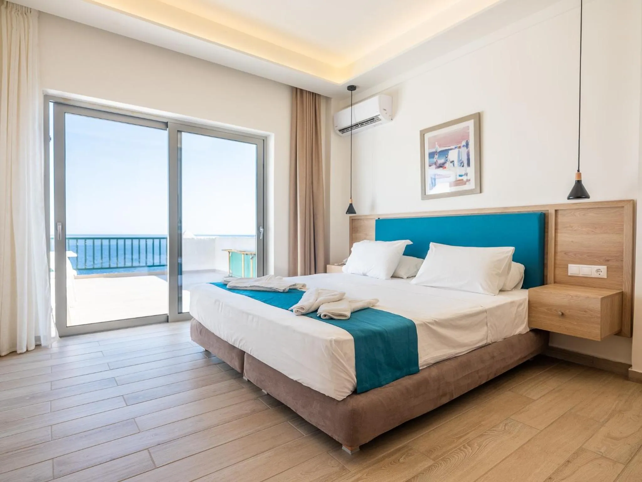 Bed in Cavos Bay Hotel & Studios