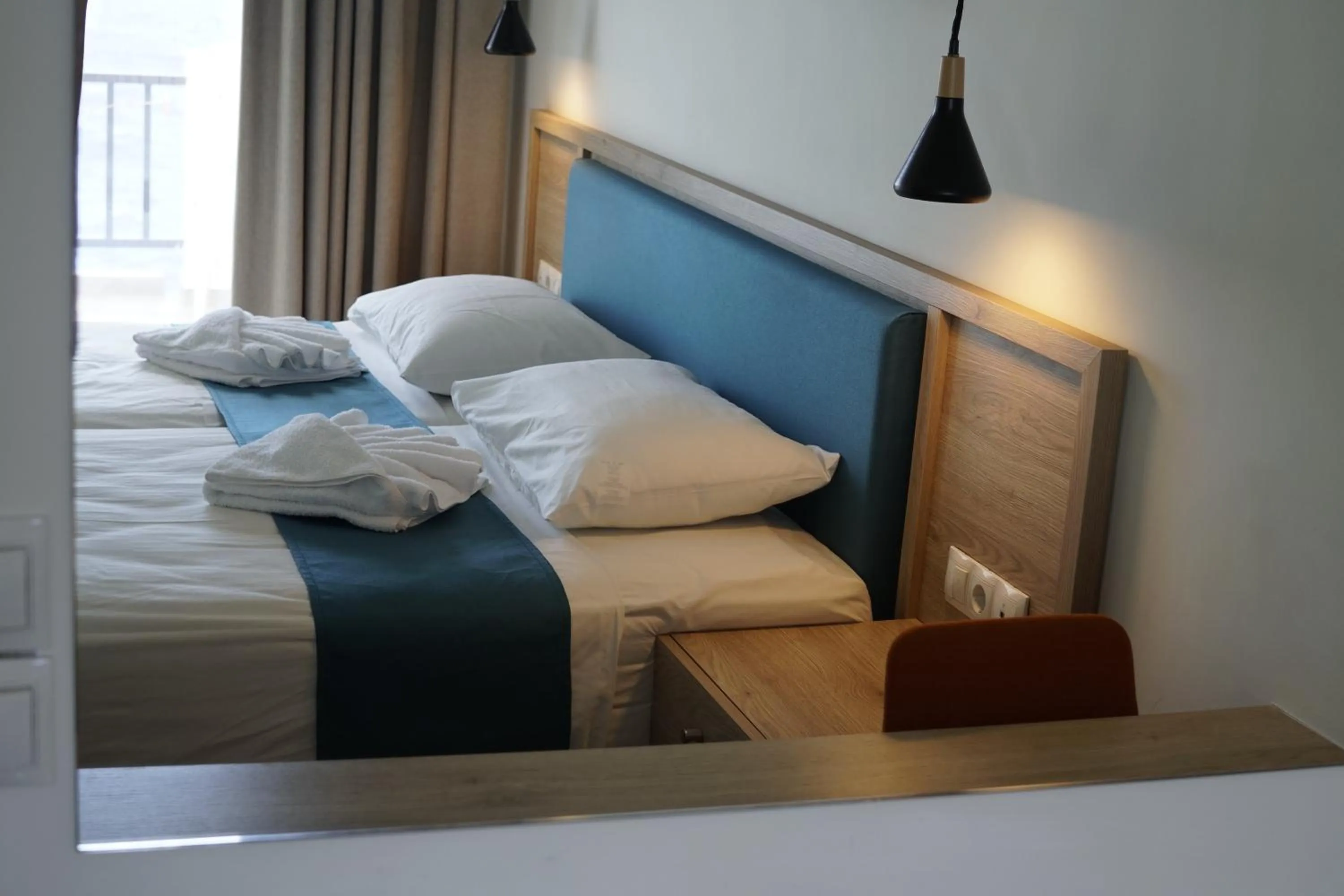 Bed in Cavos Bay Hotel & Studios
