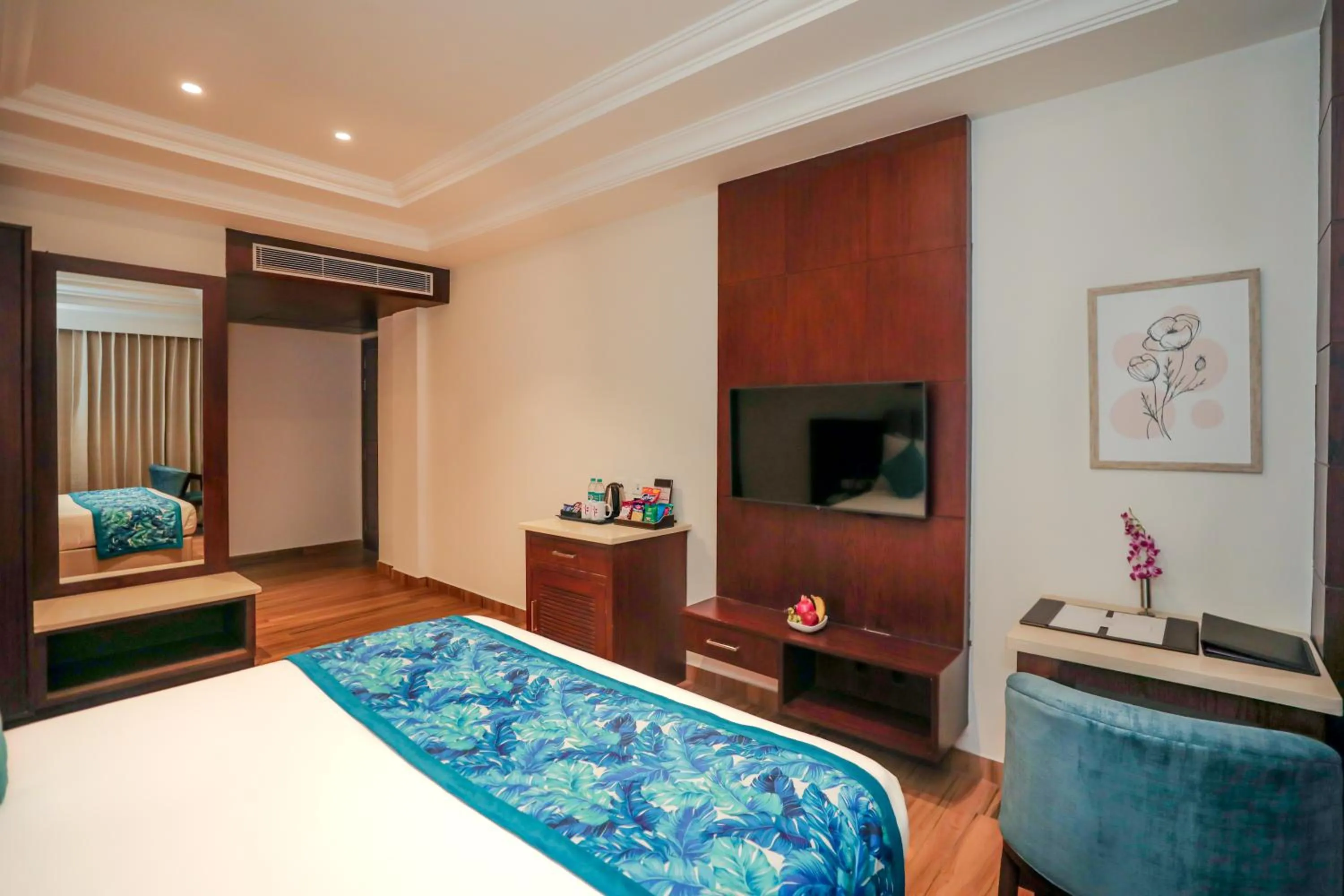 Communal lounge/ TV room, Bed in Regenta Place Phagwara by Royal Orchid Hotels Limited