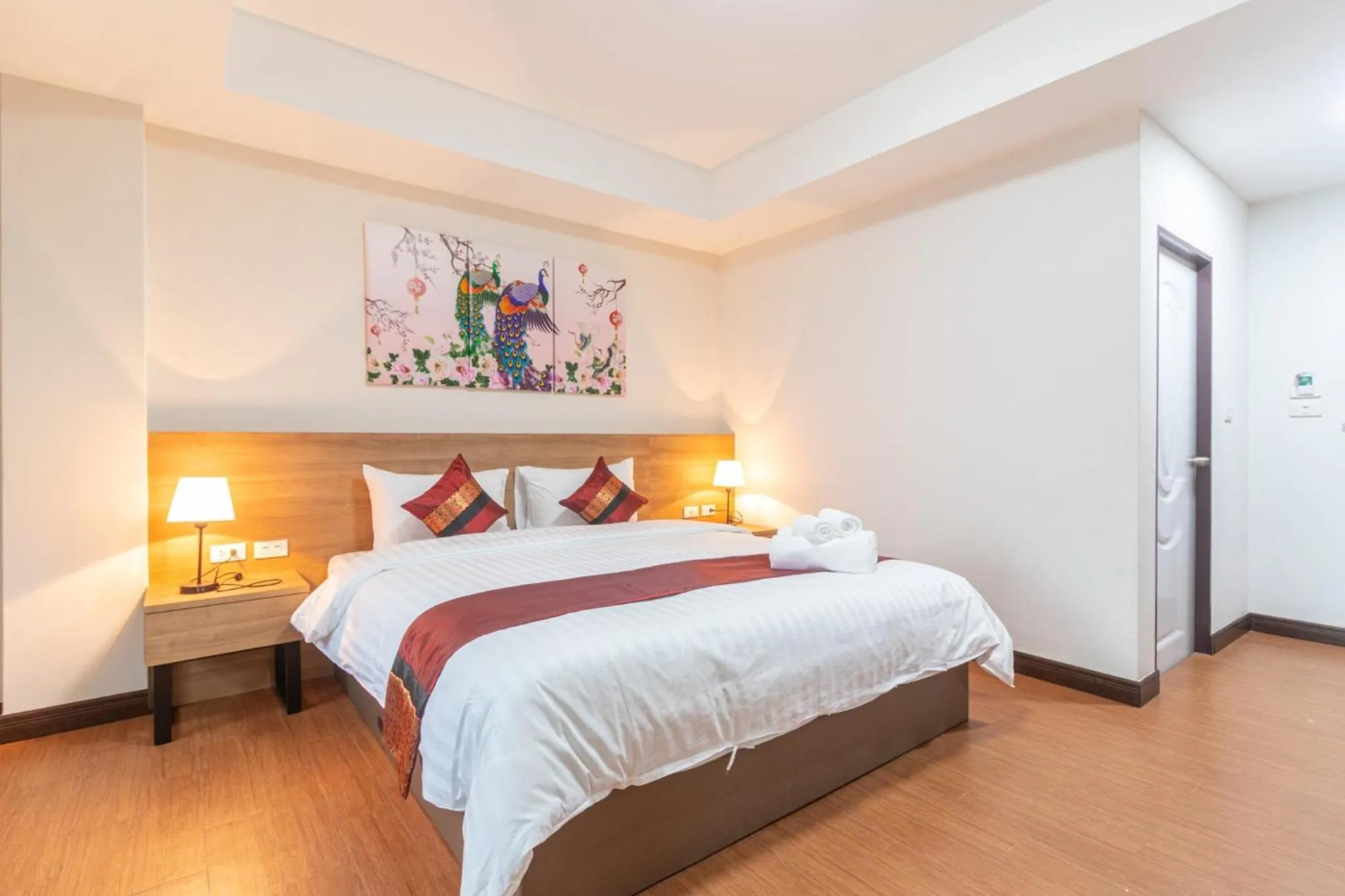 Bed in Peacock De Pai Hotel