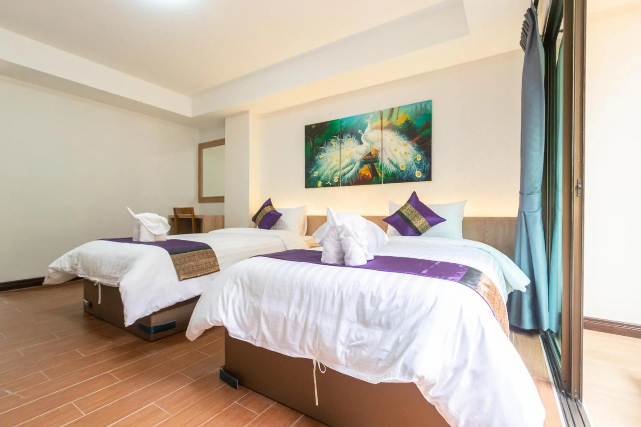 Bed in Peacock De Pai Hotel