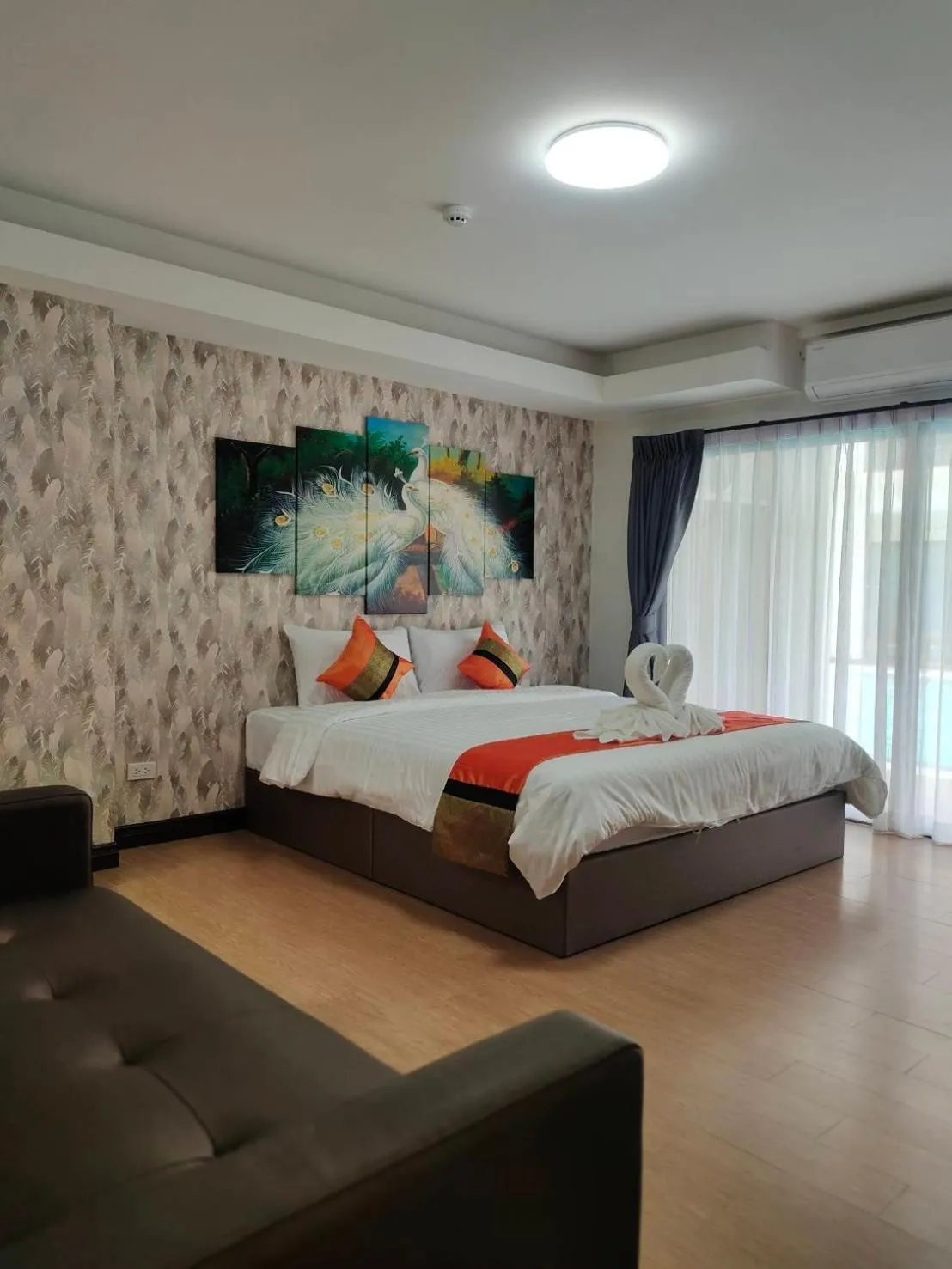 Bed in Peacock De Pai Hotel