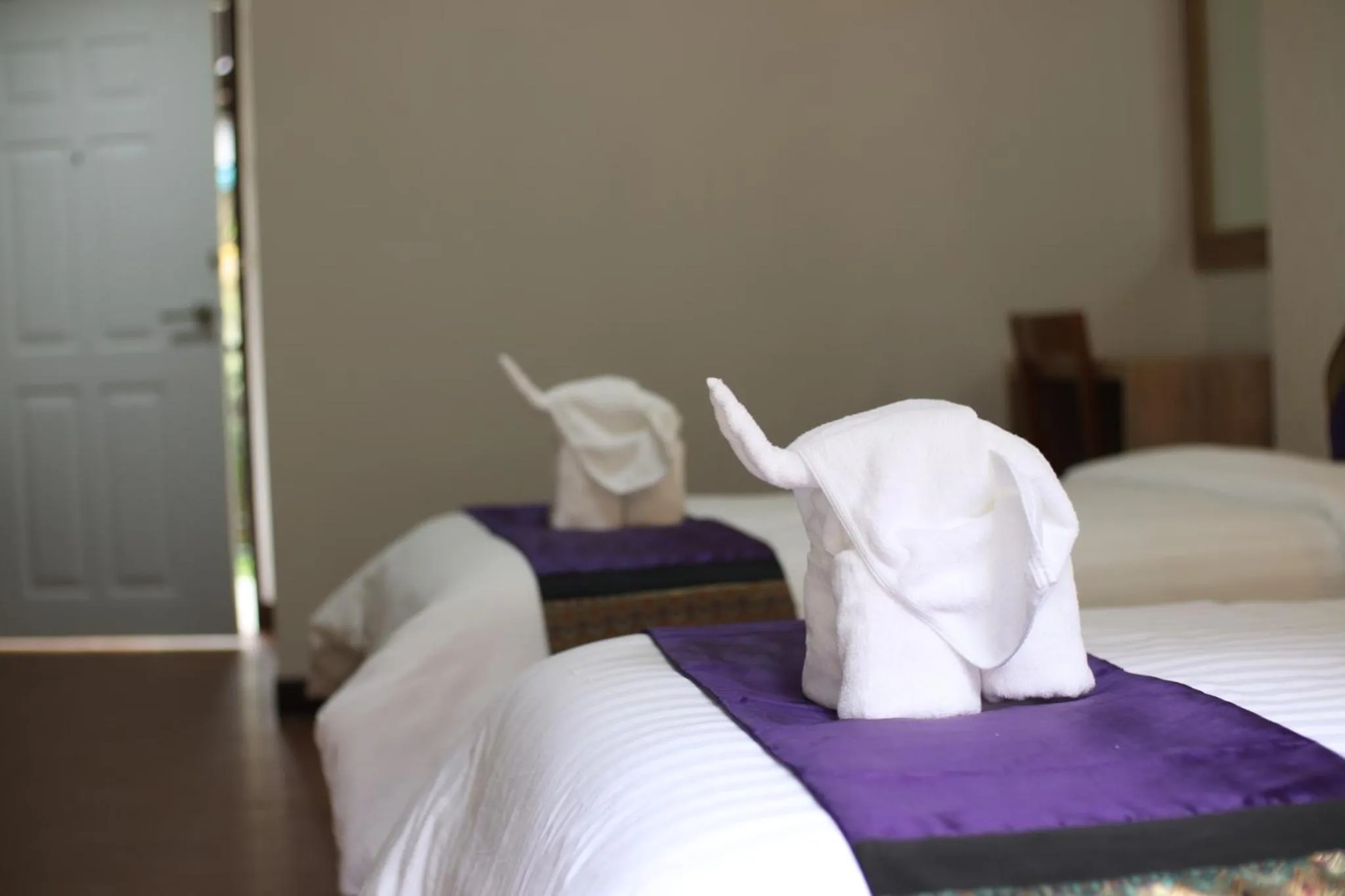 Bed in Peacock De Pai Hotel