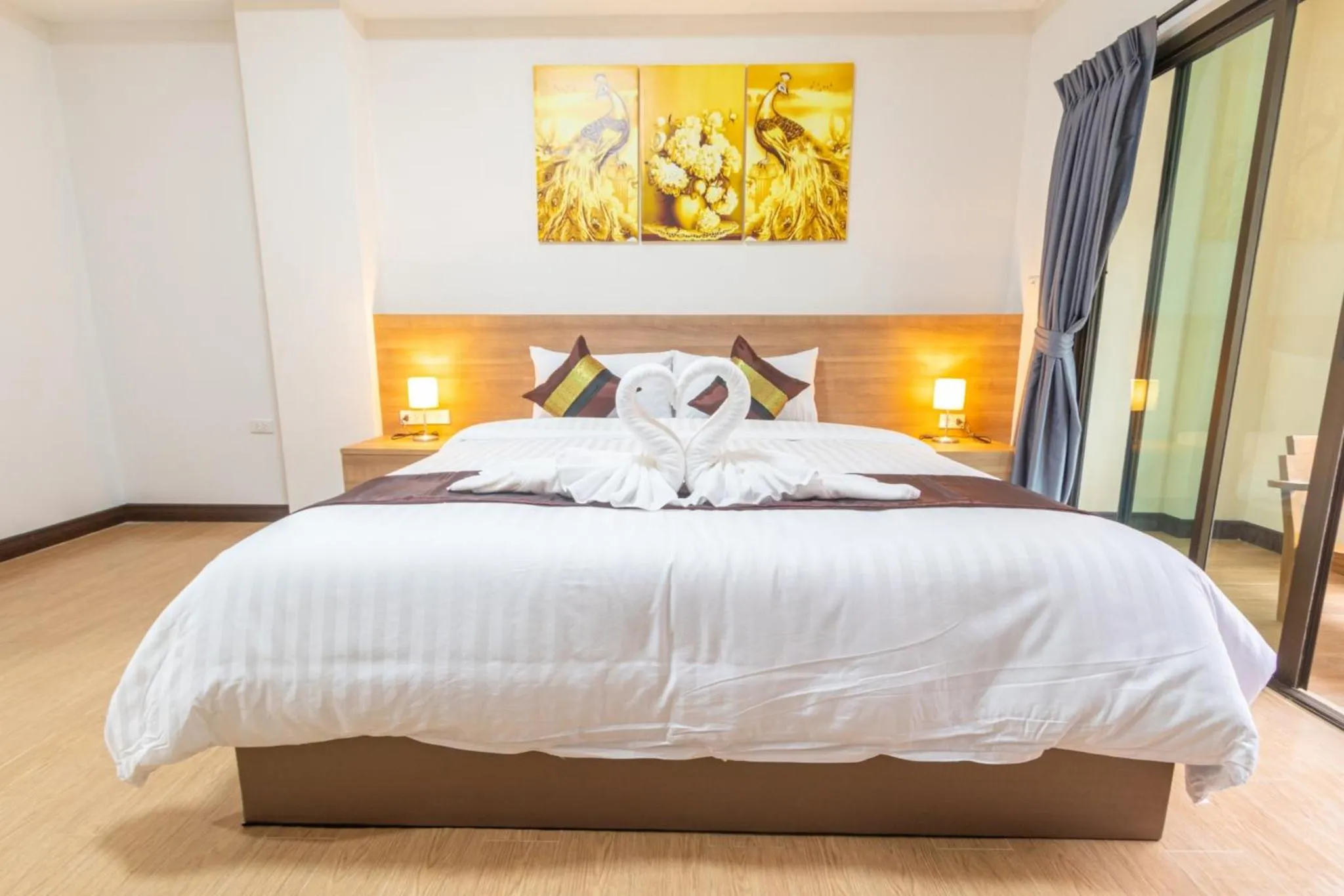 Bed in Peacock De Pai Hotel