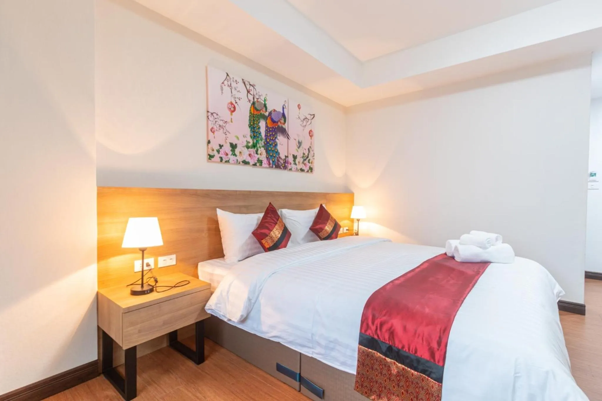 Bed in Peacock De Pai Hotel