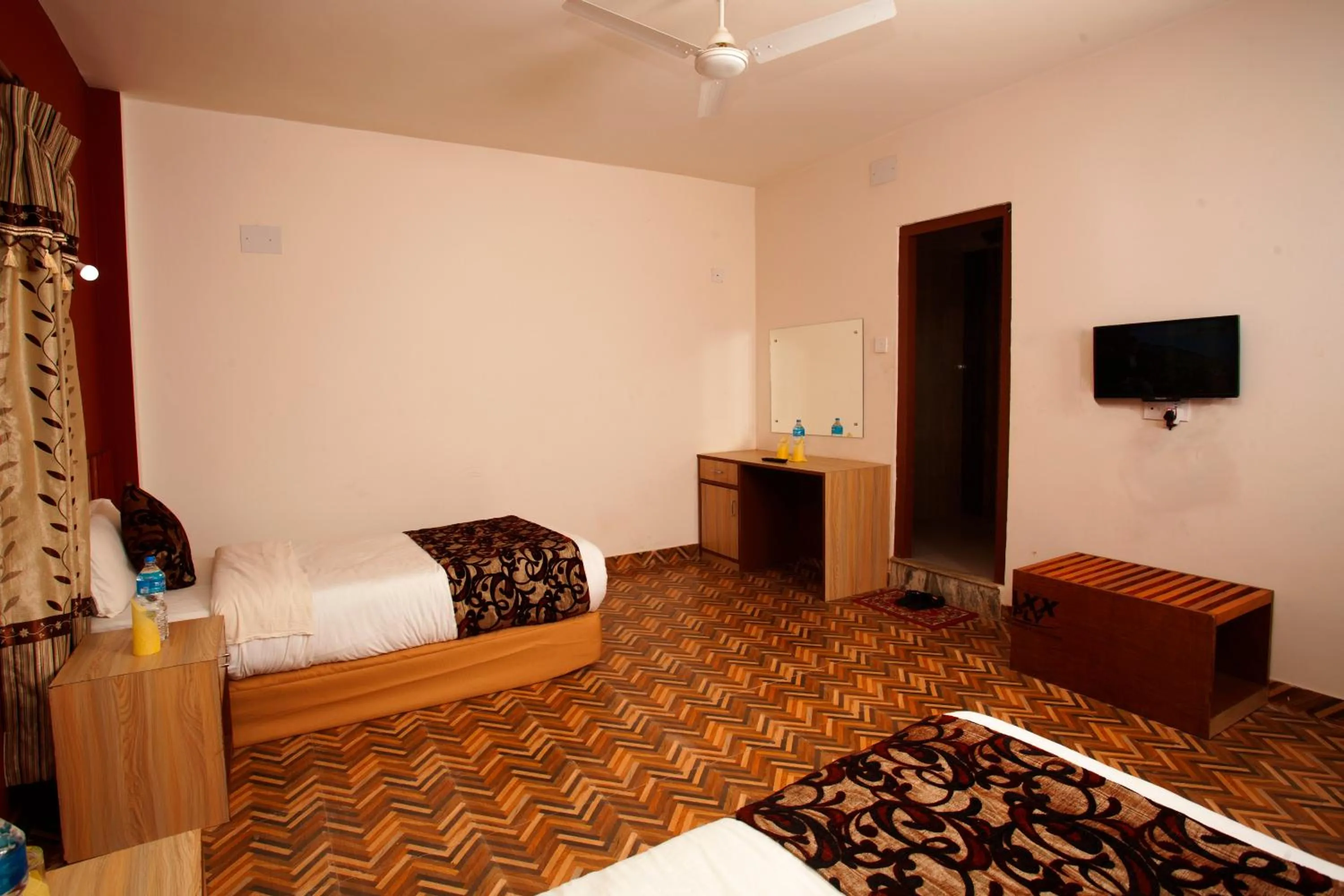 TV and multimedia, Bed in Sauraha Holiday Home Riverside by managed Hotel Surya Adventure