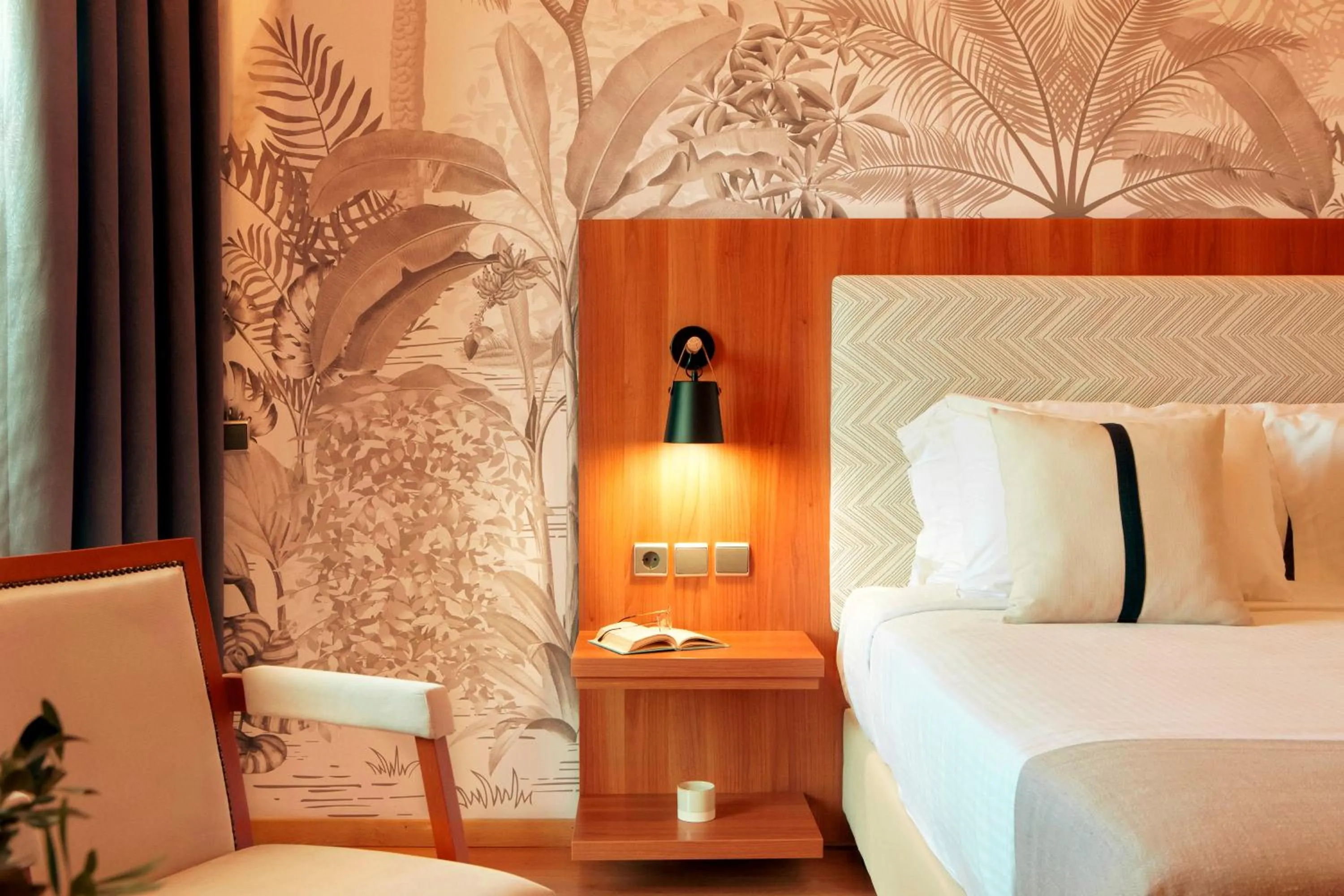 Bed in Zeus Essence Ramada by Wyndham Athens