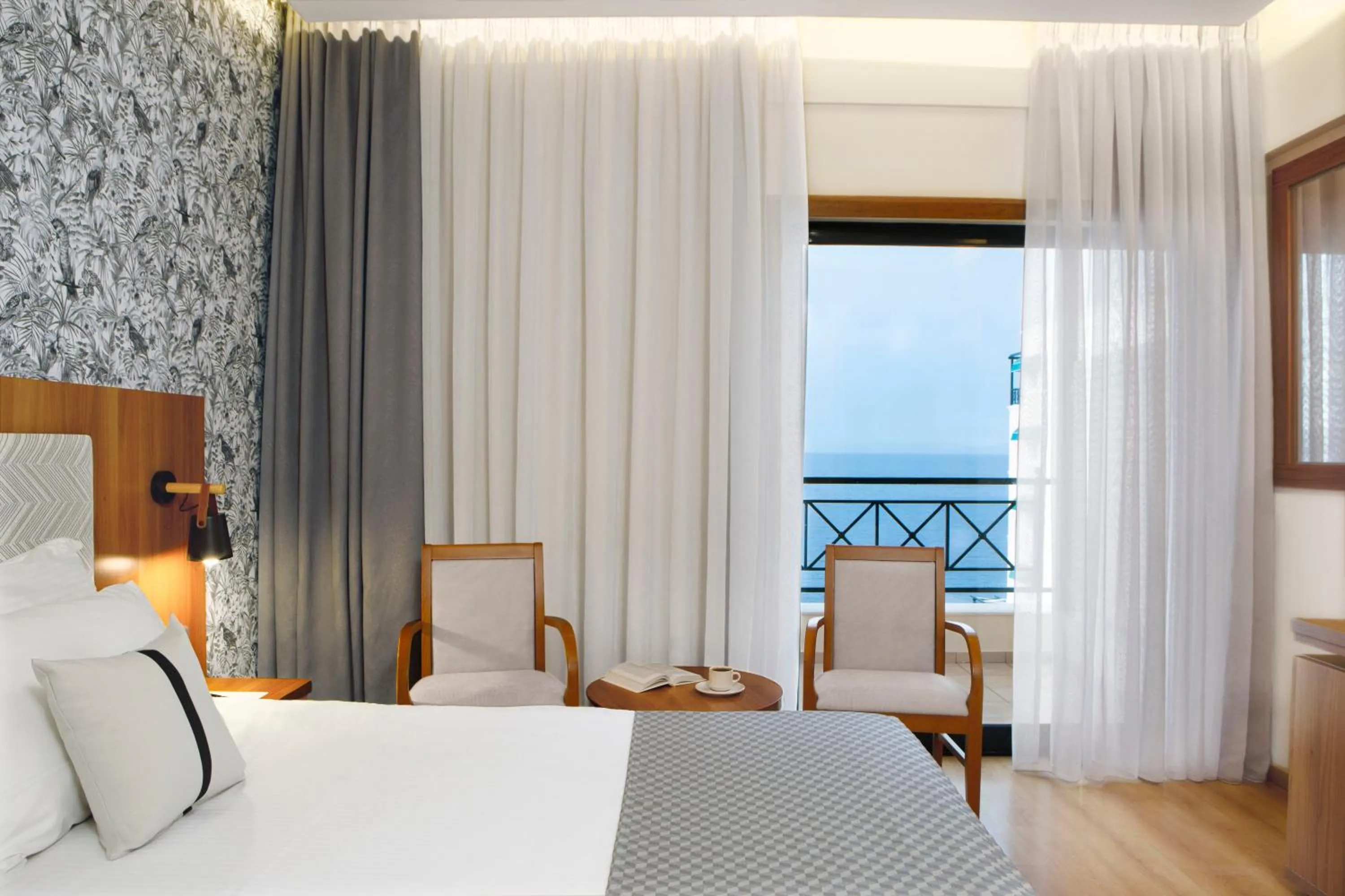 Bed in Zeus Essence Ramada by Wyndham Athens