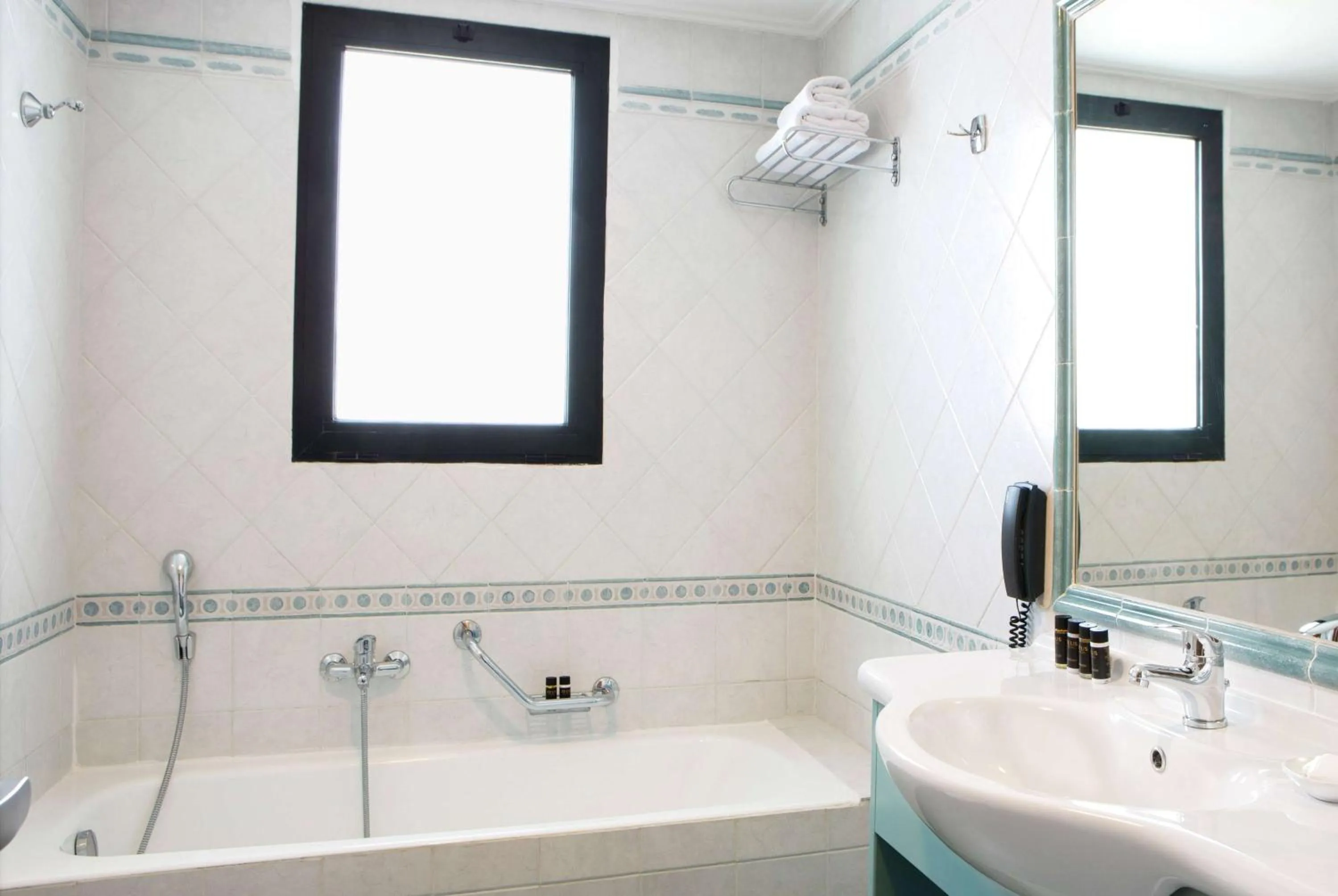 TV and multimedia in Zeus Essence Ramada by Wyndham Athens