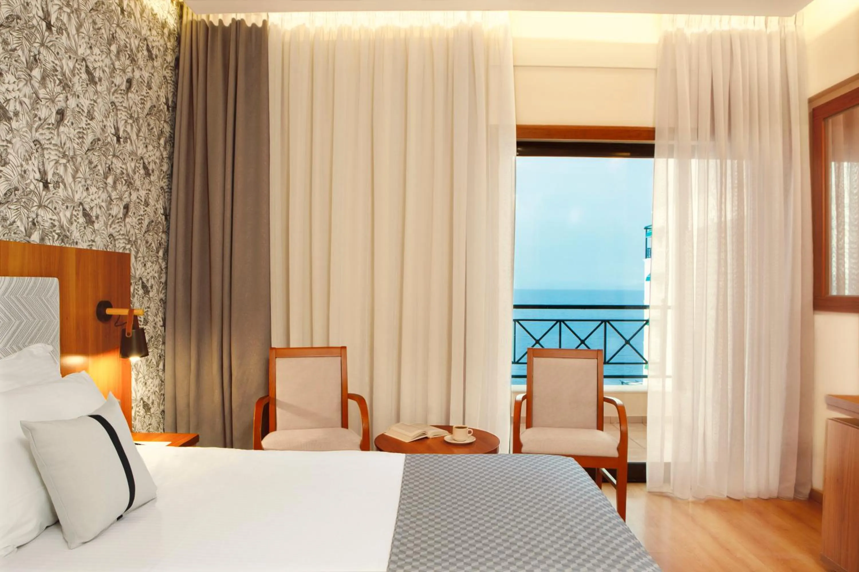 Bed in Zeus Essence Ramada by Wyndham Athens