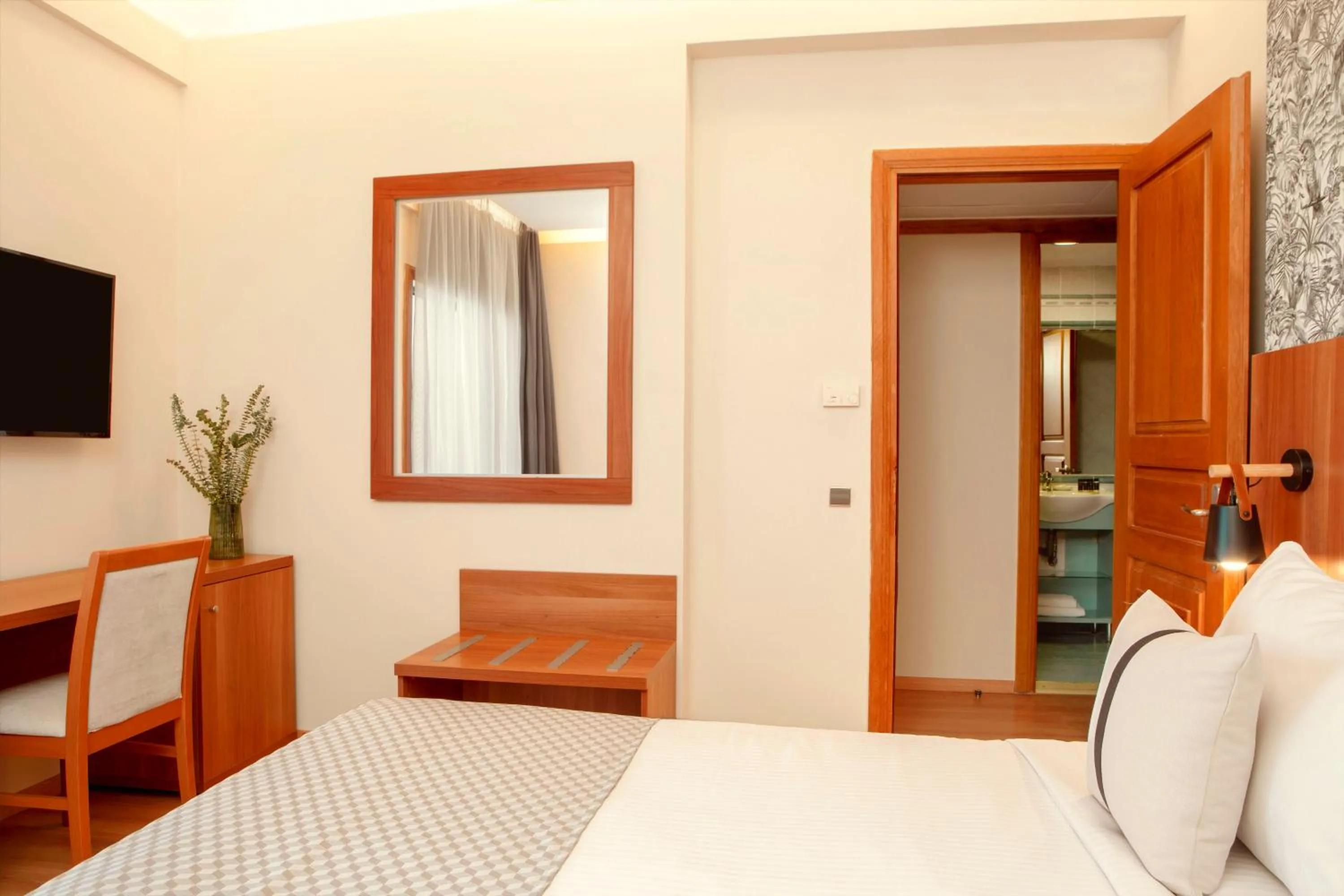 Bed in Zeus Essence Ramada by Wyndham Athens